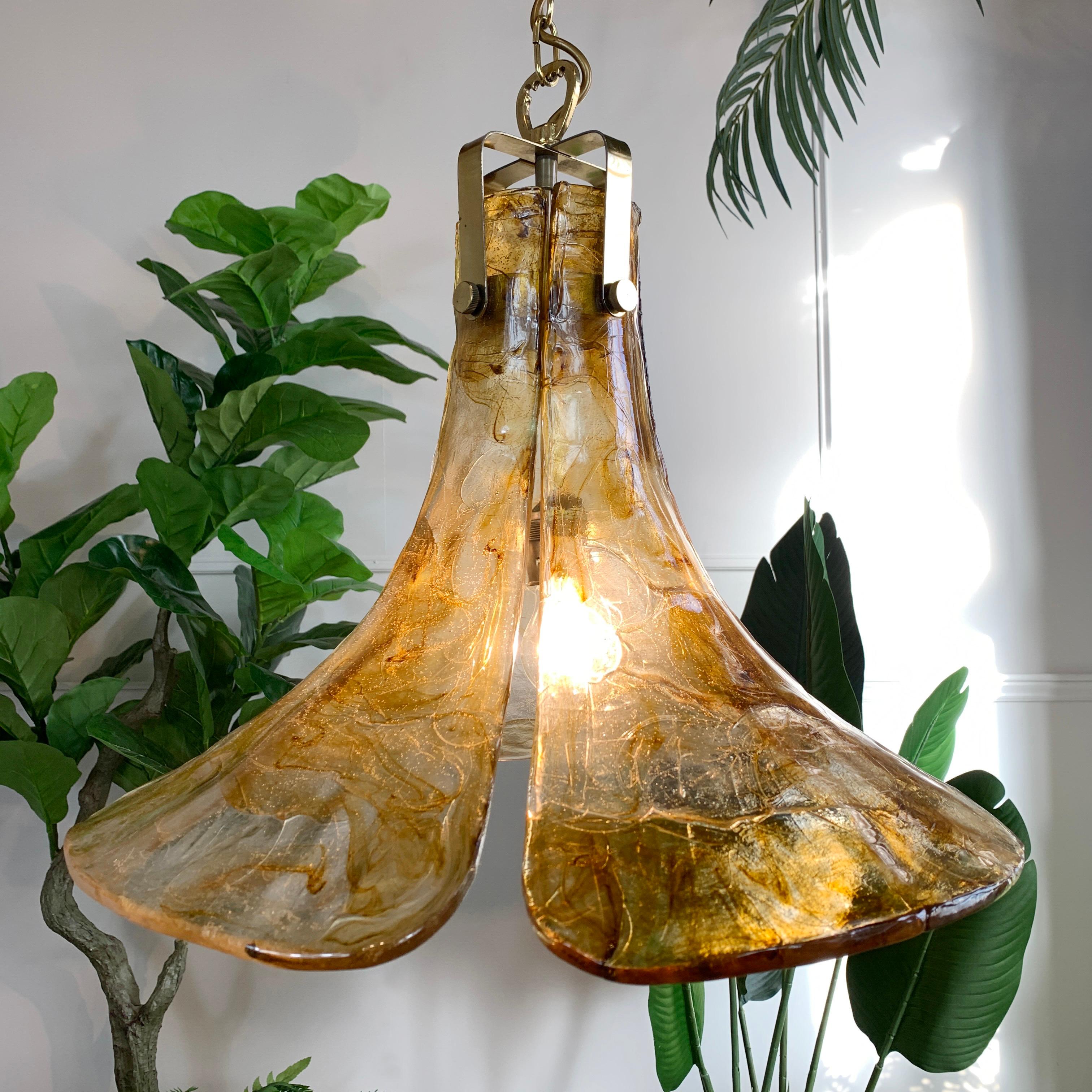 A superb amber and clear tulip flower ceiling pendant. Very much in the manner of Carlo Nason, the brass fitting takes a single large screw in bulb, the four detachable petals that form the shade appear to be made of a quality acrylic. This is not