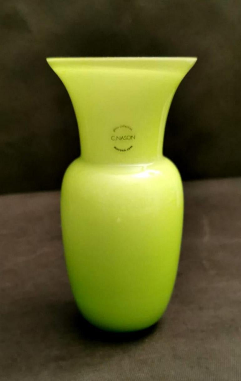 Lemon-green glass vase and white interior; the design is linear and simple but very proportioned and elegant; the lemon-green shade is also pleasant. Produced in Murano by the company C.Nason between 1980 and 1985. The vase is signed on the bottom.