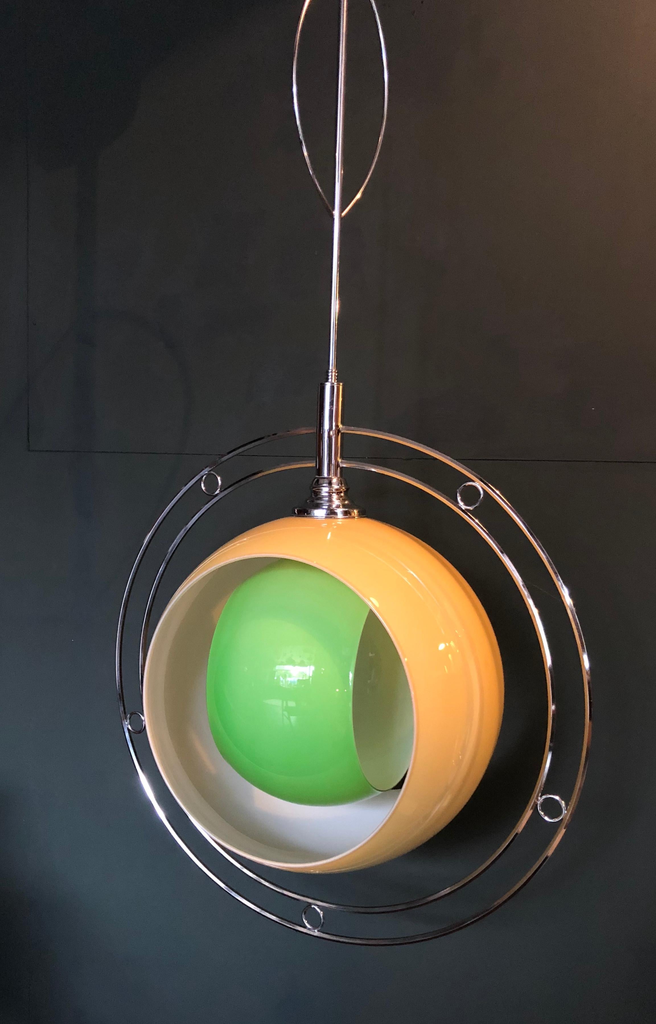 Huge pendant light design from Carlo Nason for Mazzega Murano, Italy, 1960s.
Model ‘Eclisse’. Unusual version. The Murano glass circles can rotate within each other creating a full lamp light or total eclipse glow. 130cm drop and 65cm diameter.