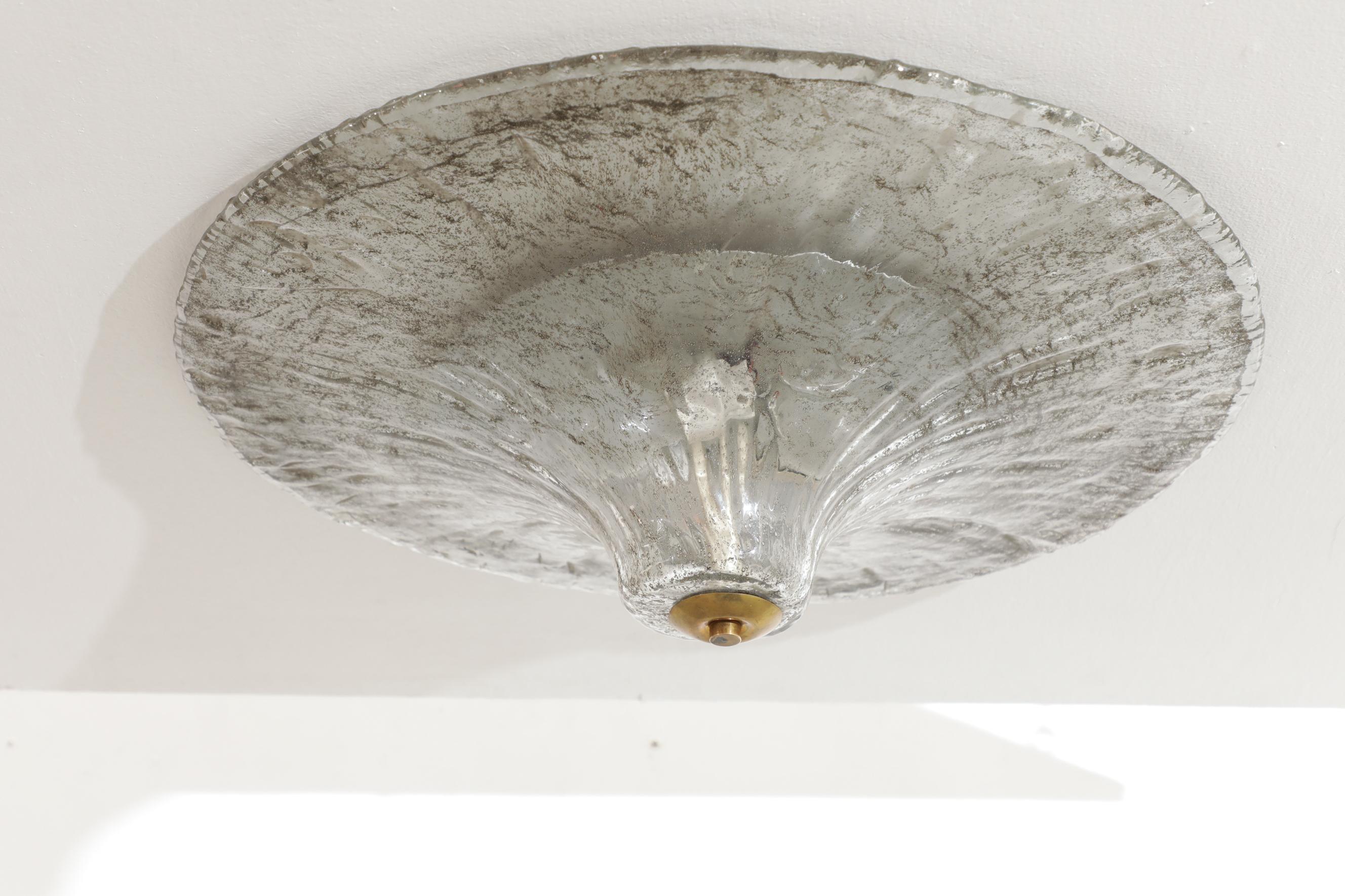 Carlo Nasson (born Murano, 1935) floral slumped glass ceiling flush mount light with brass detailing. In good original condition with no visible chips or scratches, consistent with its age and use. The brass has a great patina.