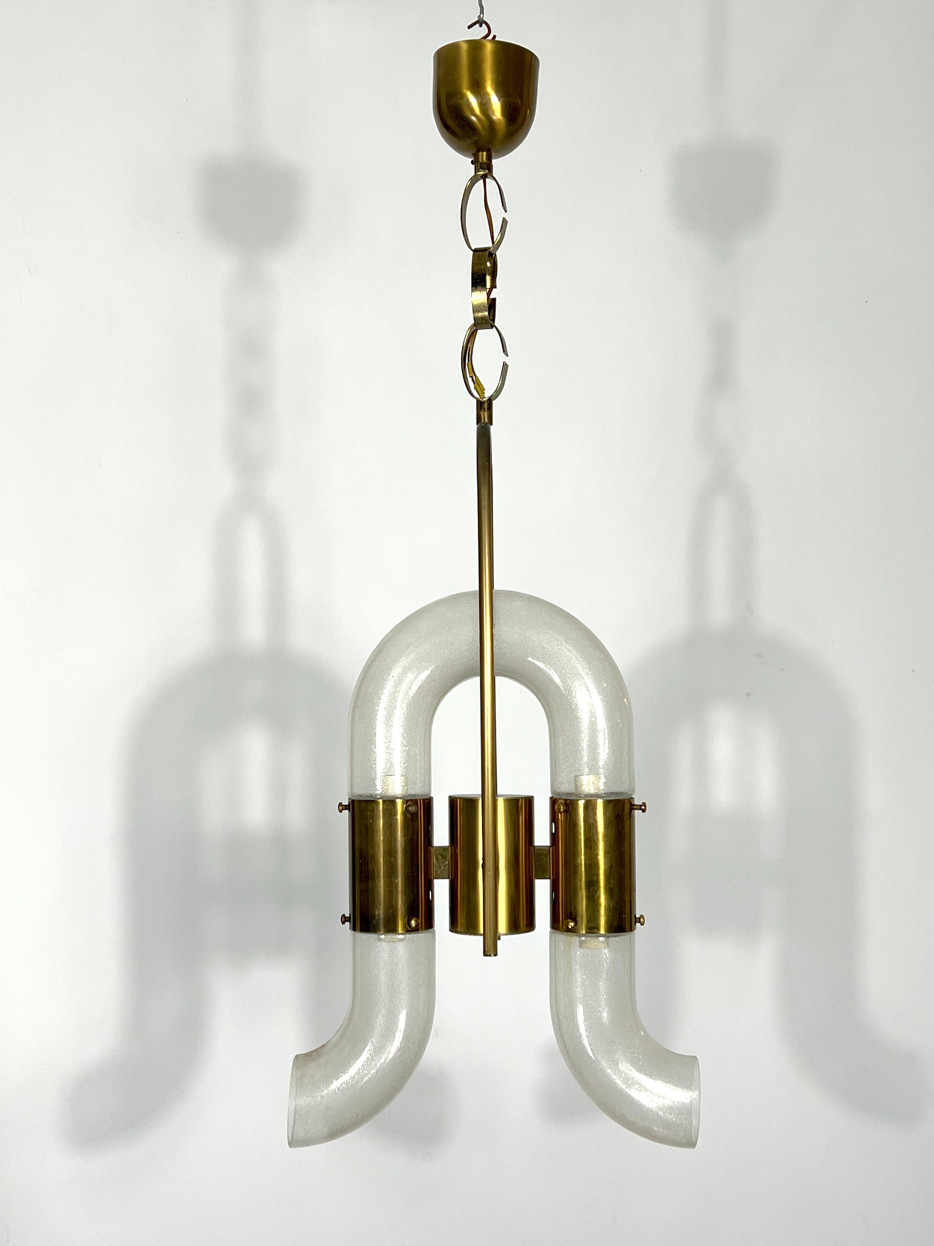 Great vintage confition with normal trace of age and use for this chandelier designed by Carlo Nason and produced by Mazzega during the 70s. It is made from solid brass and three pieces of pulegoso murano glass. Full working. No chips or
