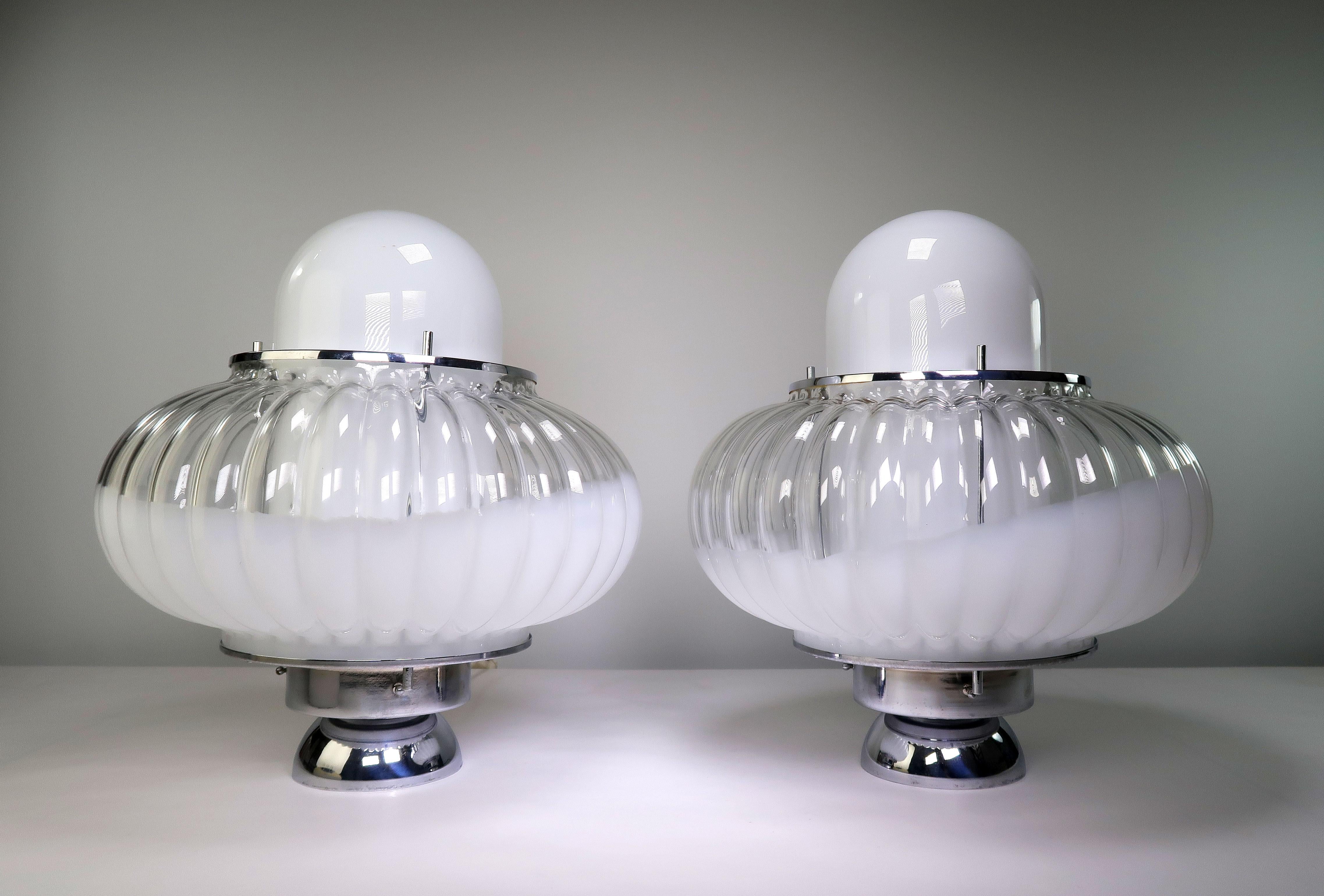 Set of large iconic Italian modernist atomic age Mazzega Murano statement table lamps by glass artist Carlo Nason. Two glass shades nesting within each other to create a spectacular and sculptural UFO like form with chrome hardware and base. Smooth
