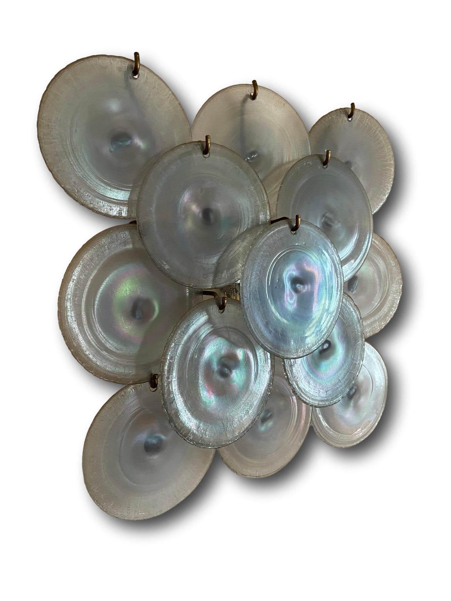 Large disc-shaped applique in irridescent Murano glass designed by Carlo Nason for Mazzega Murano, Italy 1960. The applique rests on a nickel-plated metal structure with two light sources.  Very good condition.  The glass, now impossible to find,