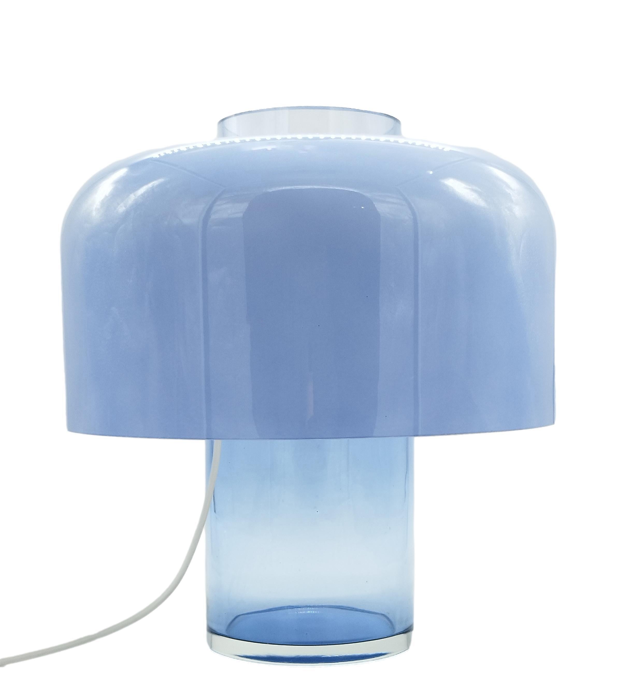 Table lamp mod. LT/226 designed by Carlo Nason for the famous Italian firm Mazzega.
The lamp's frame is made of solid glass of a rare Murano blue color and a diffuser made of cased Murano glass. The base of the lamp can, as described in A.V. Mazzega
