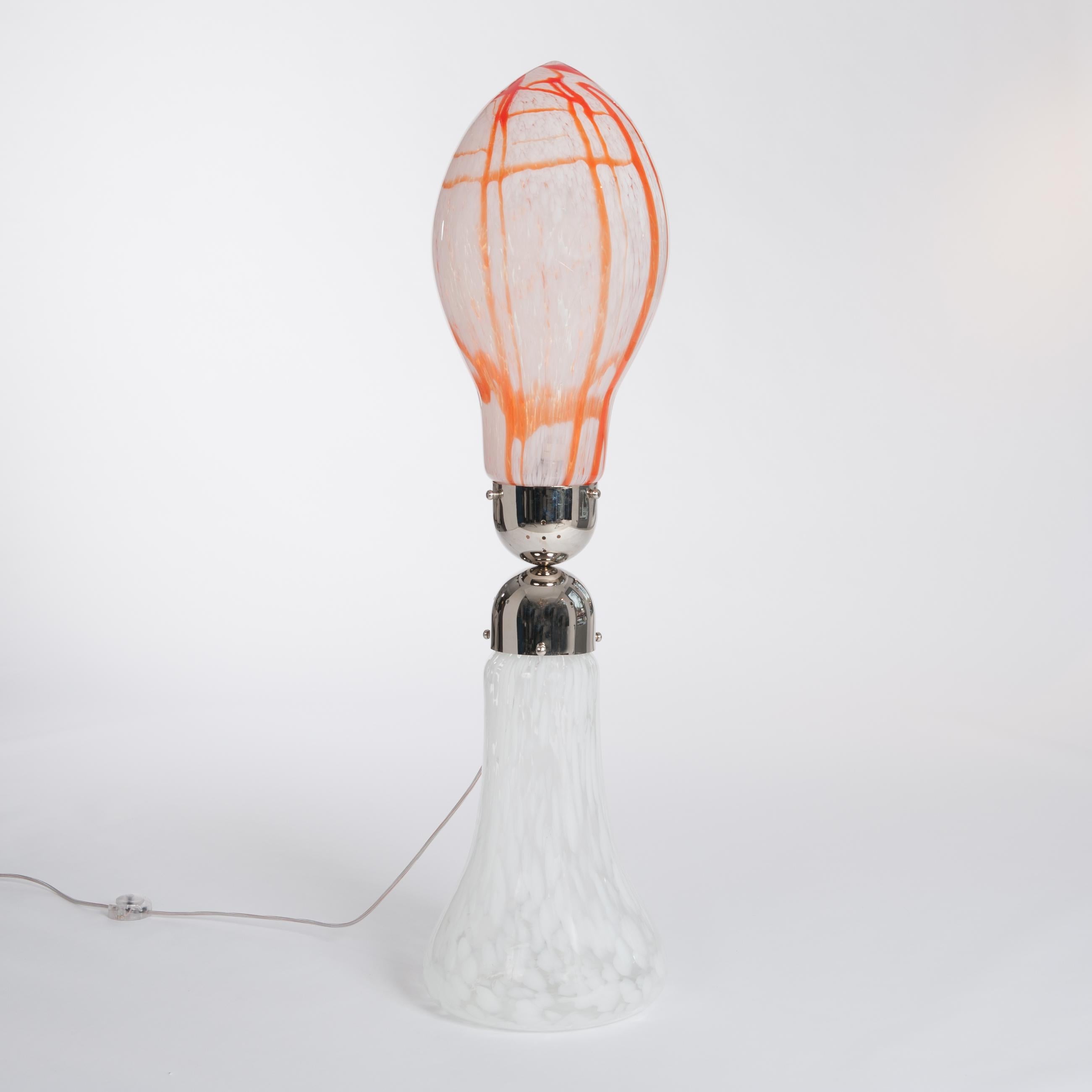 Carlo Nason lipstick floor lamp manufactured by Mazzega in the 1960s.
Two mouth blown Murano glass parts with abstract glass design in orange-red-white 
combined through a metal (re-nickeled) construction - which includes the electricfication.