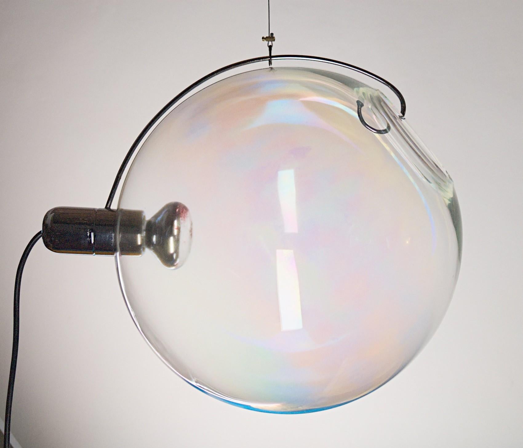This pair of lamps were designed by Carlo Nason for Lumenform in the early 1970s. Large glass sphere. All the traditional concepts of a lamp has been radically changed.
The glass is not a shade, it's to change the orientation of the spot light.