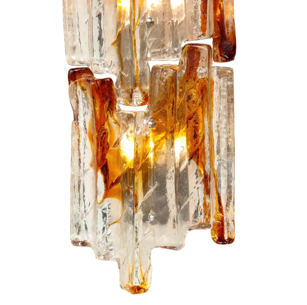 Hand-crafted pair of Murano amber streaked ice-glass wall sconces with polished chrome back plates each holding four, GY6 pin base, T6 LED bulbs. Designed by Carlo Nason for Mazzega. Italy, 1960s.



Dimensions of each:
Width: 8 inches
Depth: 4