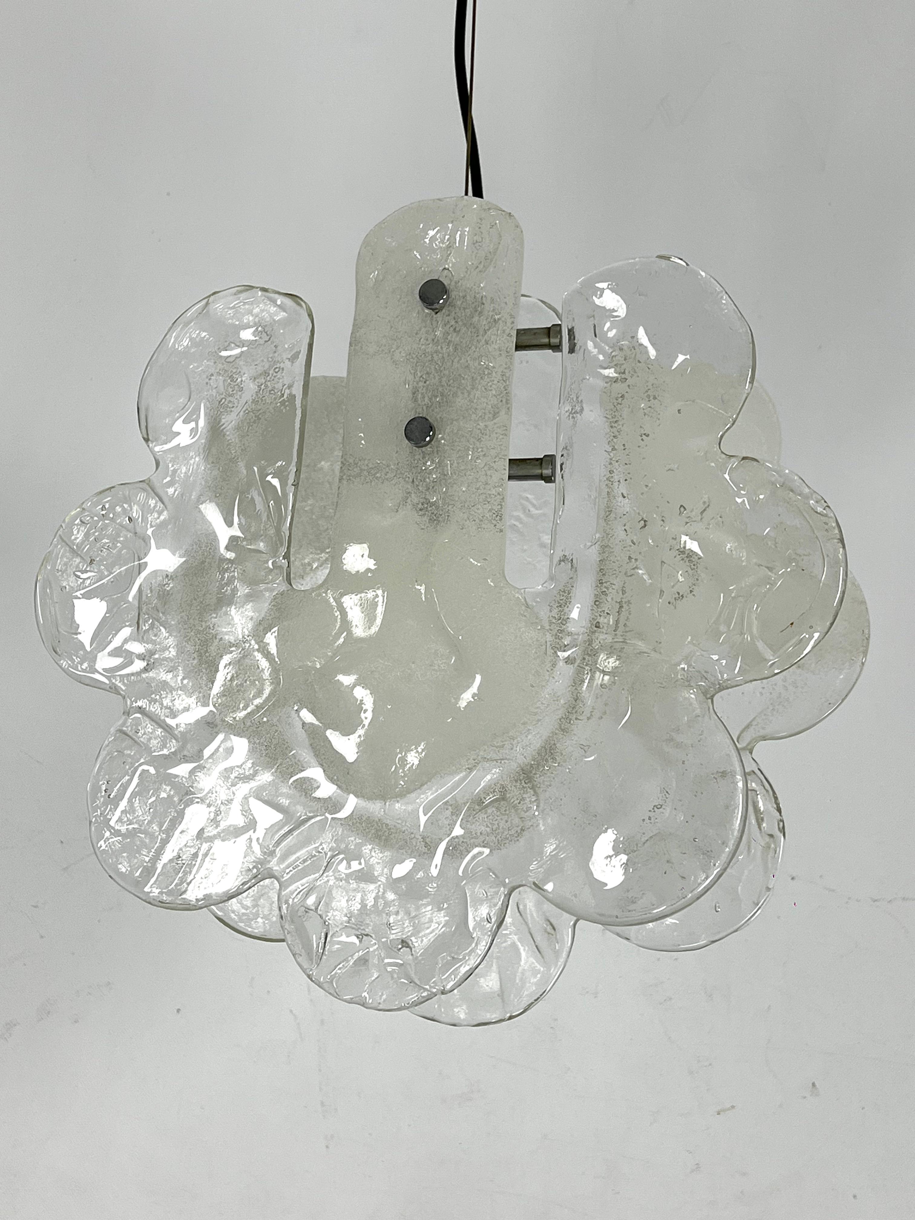 Pendant light in pulegoso Murano glass, designed by Carlo Nason for Mazzega and produced in Italy during the 70s. Glasses in perfect condition. Metal parts with trace of age and use. Full working with EU standard, adaptable on demand for USA