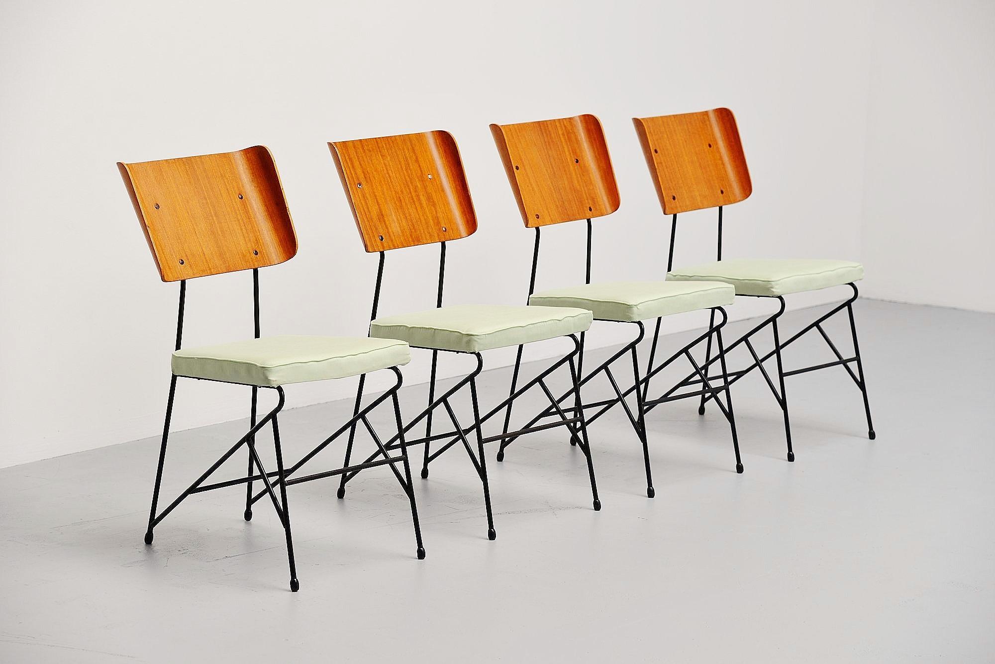 Very nice set of dining chairs designed by Carlo Ratti, manufactured by Legni Curva, Italy 1950. These chairs have a solid metal frame, black lacquered. They have some kind of green silk upholstery and teak plywood backs. The chairs are very nice