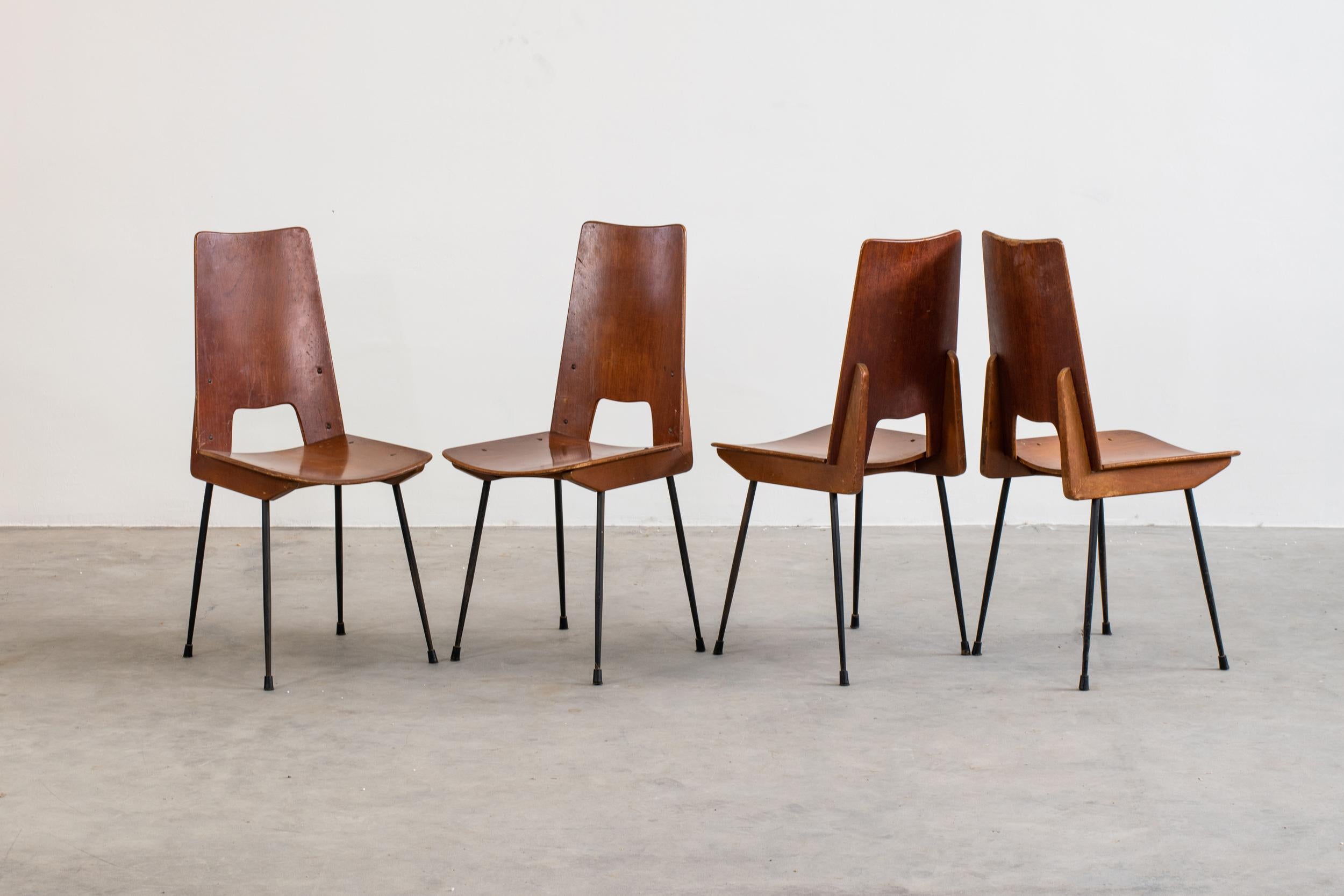 Set of four dining chairs in wood and painted metal, designed by Carlo Ratti, 1950s, Italy. 
  