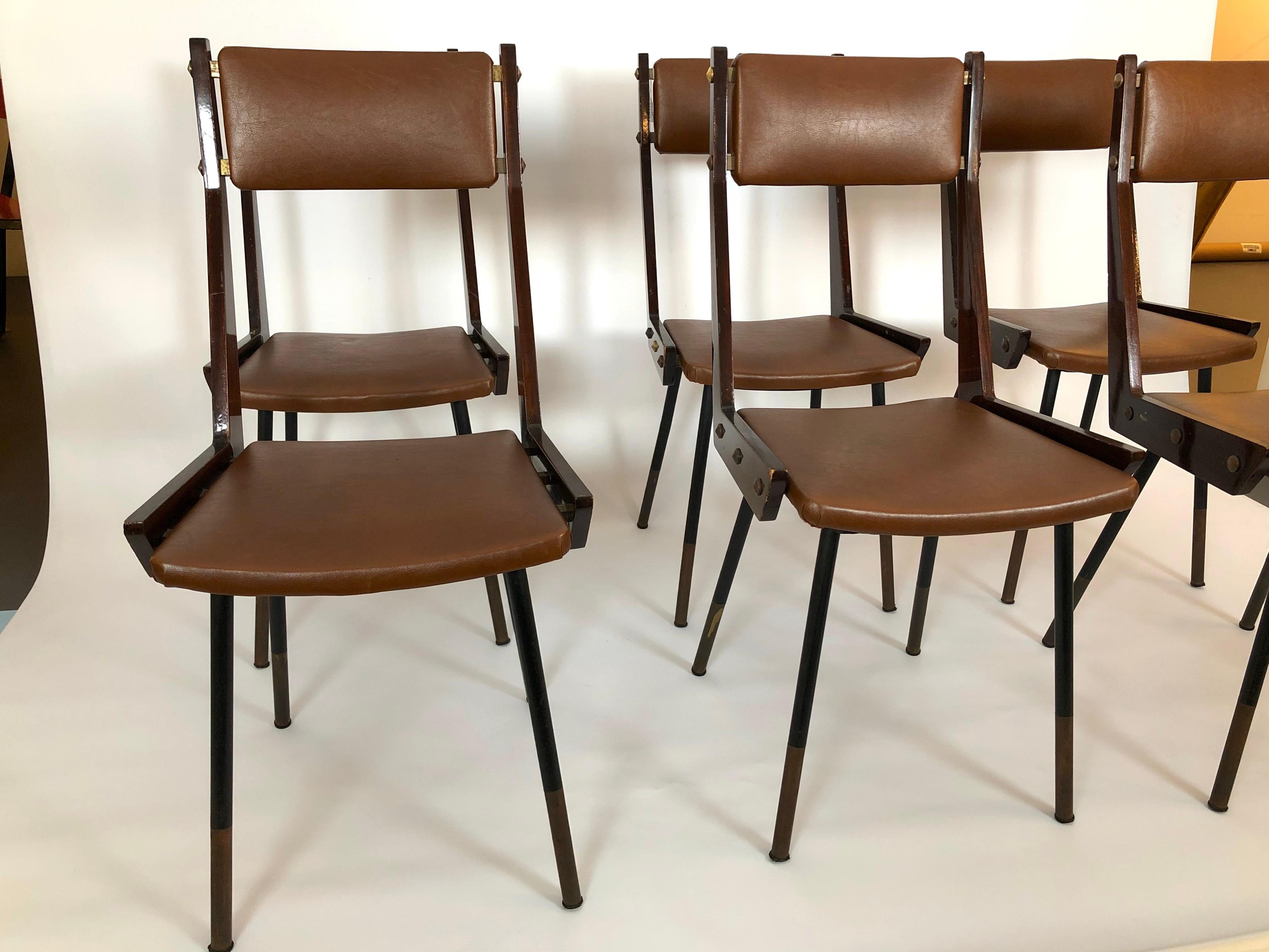 Good vintage condition with normal trace of age and use for this set of six dining chairs designed by Carlo Ratti and produced in Italy during the 50s. Made from wood, metal and beautiful brass details. Original brown leatherette.
