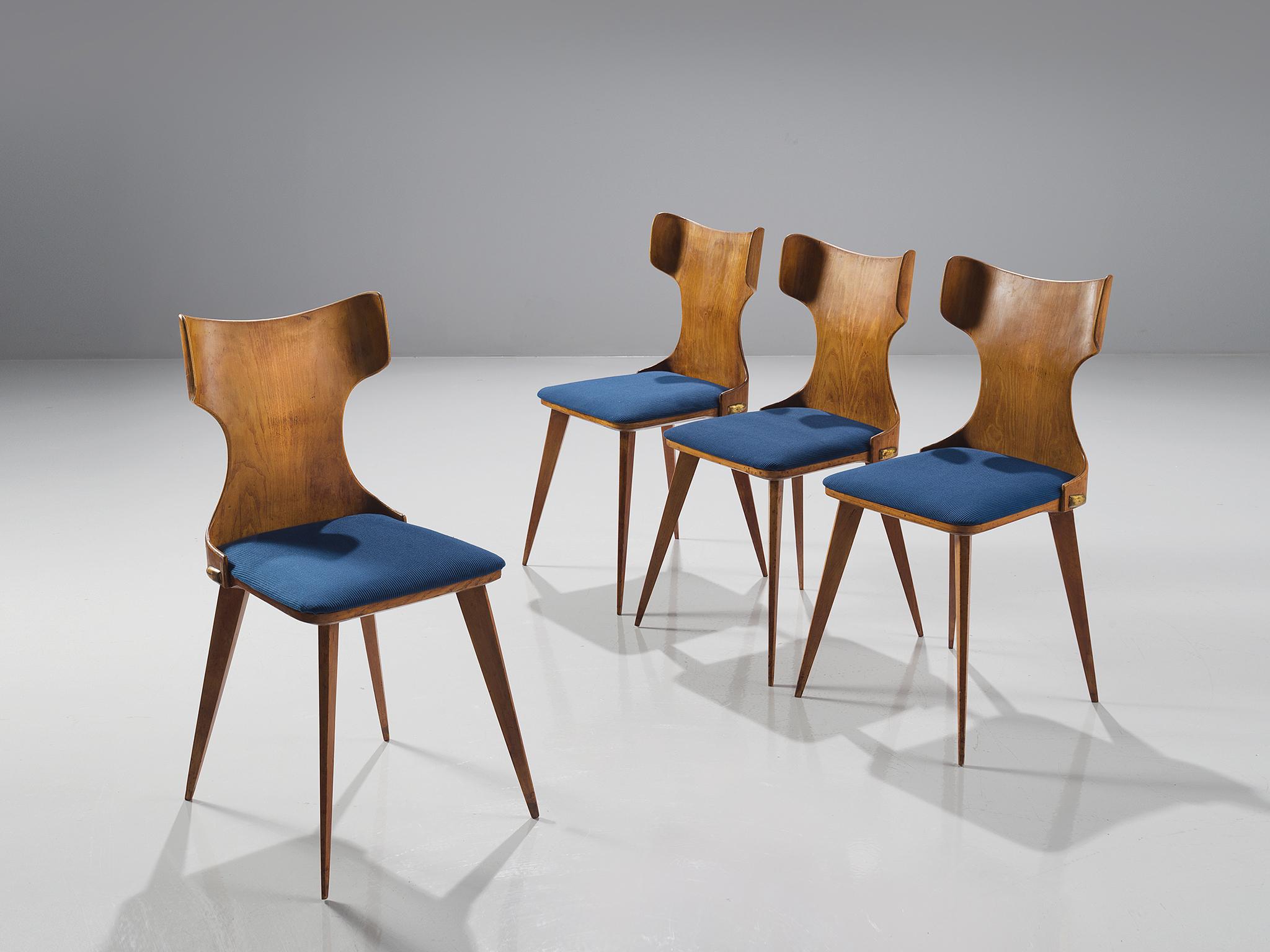 Carlo Ratti, four dining chairs in bent wood and blue fabric, Italy, 1950s.

This Italian set of dining chairs is part of the midcentury design collection. The set is executed in bent wood with a blue upholstered seat. The legs are tapered and