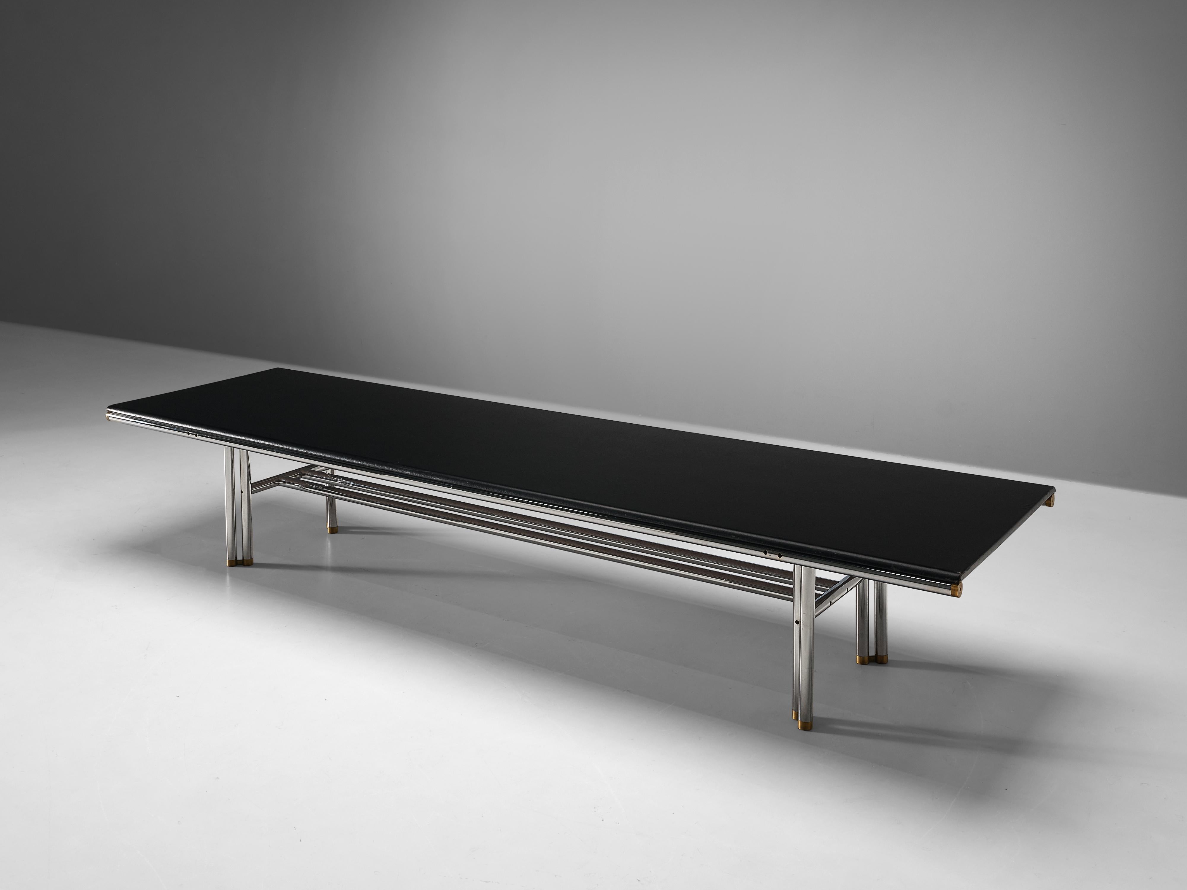 Carlo Scarpa and Hiroyuki Toyoda for Simon Gavina, conference table, faux leather, chromed steel, brass, Italy, 1970s

Elegant conference table was initially designed by Carlo Scarpa in 1973. However, it never went in to production. After Scarpa’s
