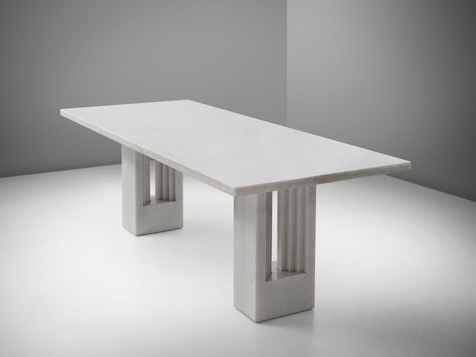 Carlo Scarpa and Marcel Breuer, dining table 'Delfi', marble, by Italy, 1970. 

Beautiful white colored marble table by Italian designer Carlo Scarpa. This center table is very stately. The legs with gradual lines remind of classical roman columns