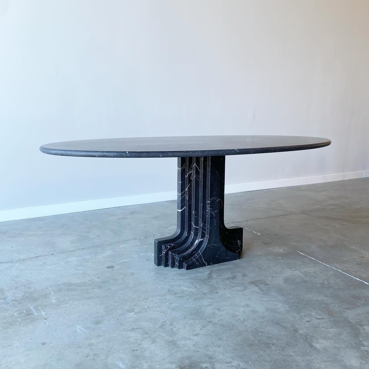 Carlo Scarpa Argo Dining Table in Nero Marquina Marble, Cattelan Italia 

A stunning vintage example with original Catalan Italia packing tape marking the bottom.  This black marble table has been buffed to a satin finish so the table shows a dark