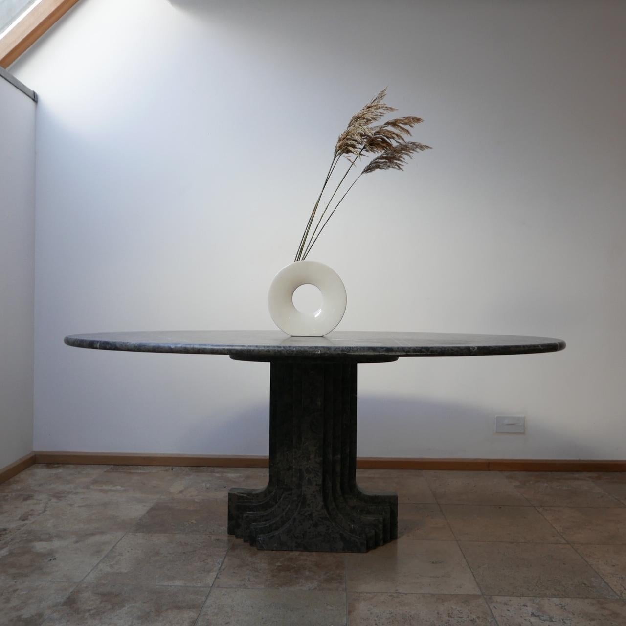 A scarce marble table by Carlo Scarpa.

Italian, circa 1980s.

Beautiful veined marble with evidence of ammonites in the stone.

A scarce design that is completely timeless.

The architectural influenced base is a piece of art in