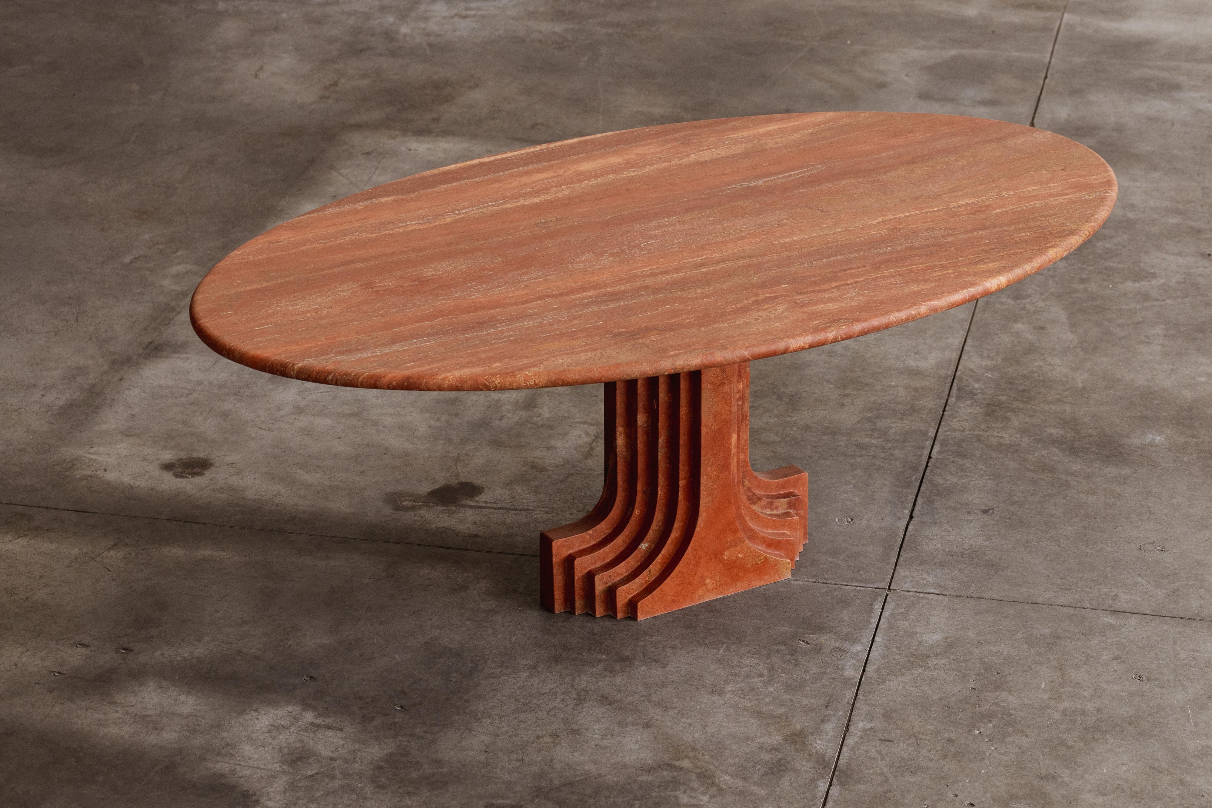 Carlo Scarpa “Argo” oval table for Simon Gavina in red travertine marble, Italy, 1975.

The “Argo” travertine console-table is part of the ‘Ultrarazionale’ collection by Simon Gavina. In the base of the table is the architectural influence visible