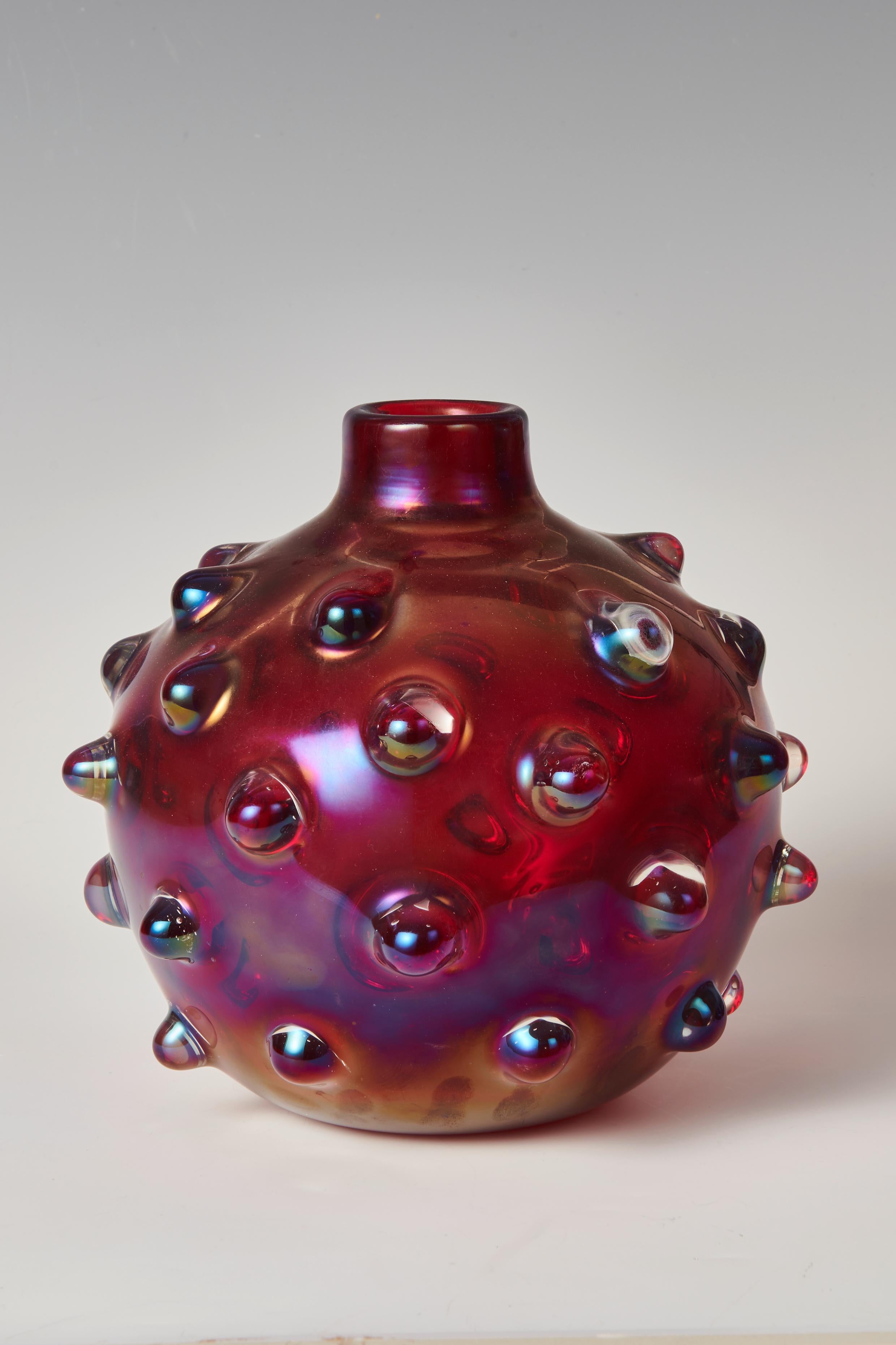 Carlo Scarpa (1906-1978), 'Bugne' vase, 1936

hand-blown glass, iridescent surface

modell 3739
produced by Venini & C., Murano, Italy

signed with four-line acid stamp to underside 'venini murano MADE IN ITALY‚

excellent condition

LITERATURE
this