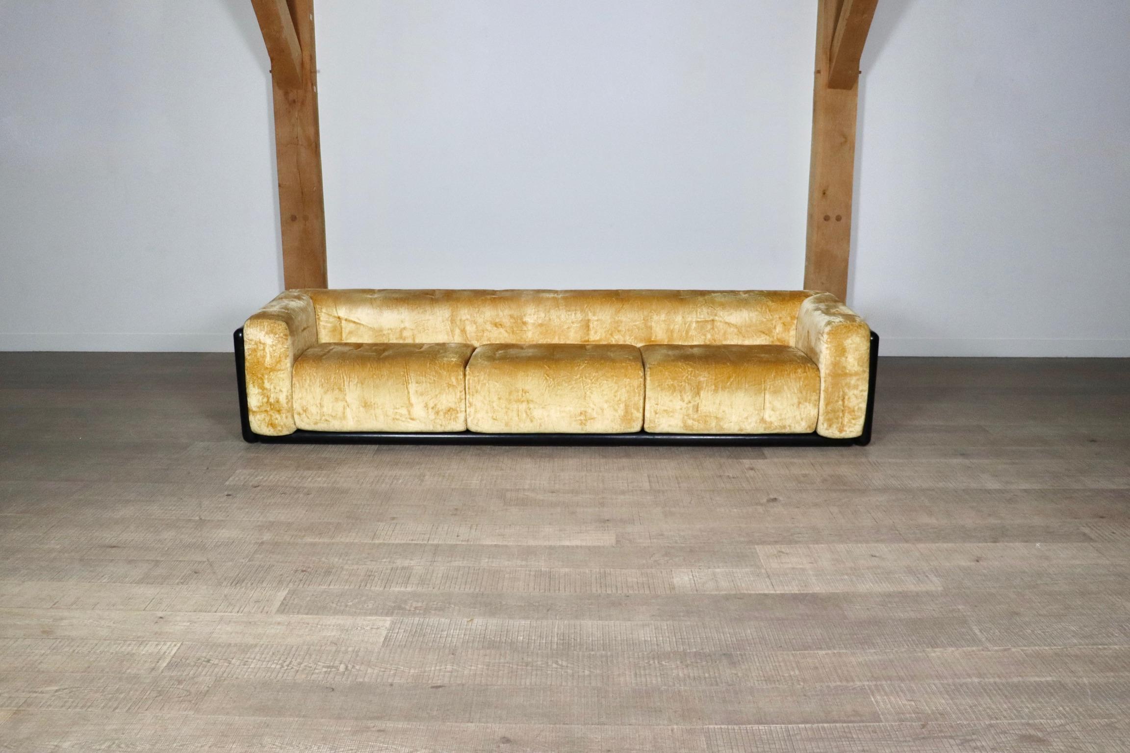 Impressive Cornaro sofa in original warm yellow velvet designed by architect Carlo Scarpa and manufactured by Simon Gavina in Italy in 1973. With a solid cylindrical black lacquered ash wooden frame, and the original warm yellow velvet upholstery.