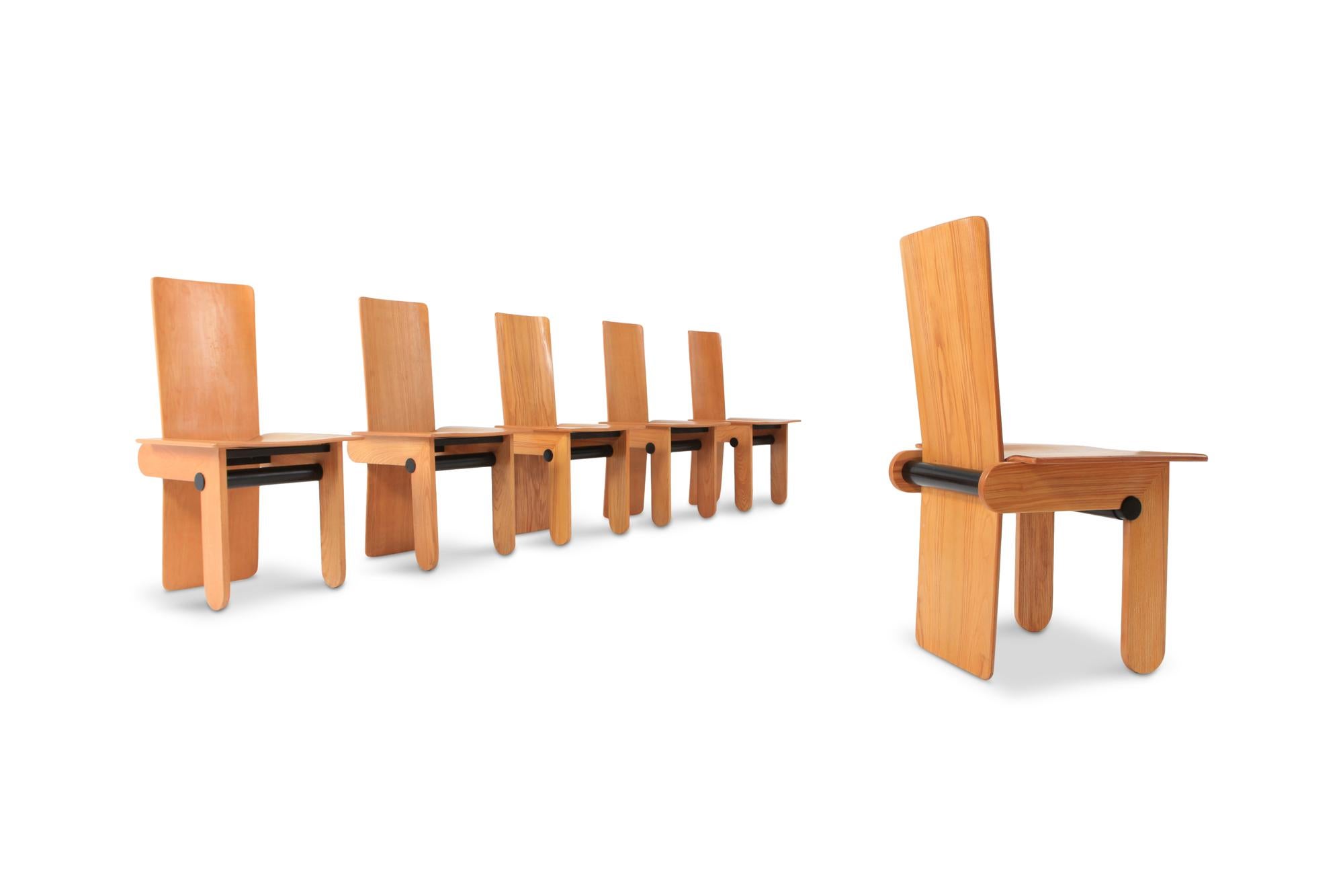 Gavina produced this rare set of six dining chairs designed by Carlo Scarpa in 1974. 

The style is a bit Postmodern but still feels very contemporary. A combination of Italian pinus and ebonized wood. Very sculptural and architectural.