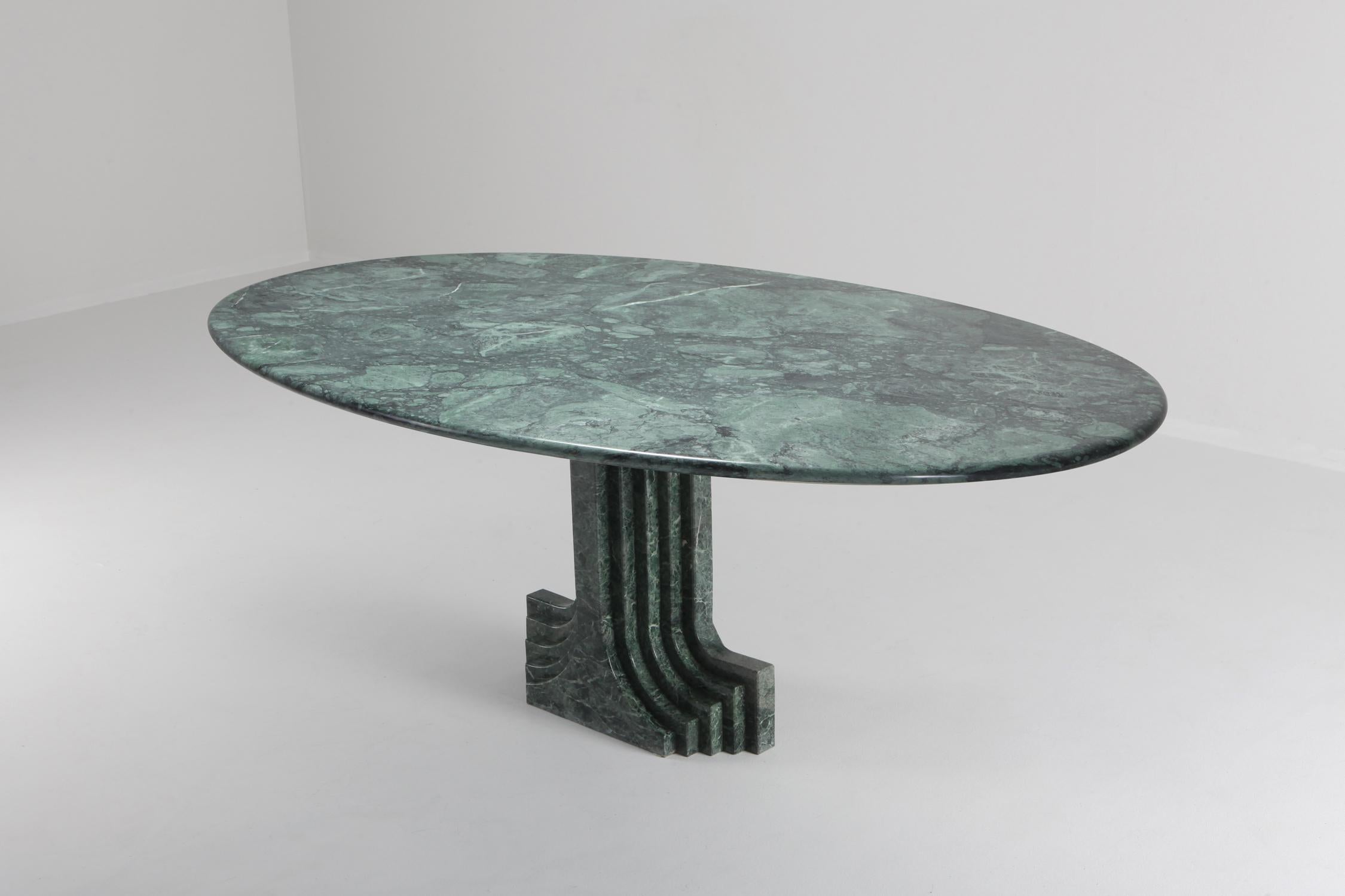 Carlo Scarpa ‘Samo’ table, produced by Simon, Italy, 1970s. 
Part of the ‘Ultrarazionale’ collection by Simon, the base is formed of two pillars of marble, layered like map contours in relief. The oval tabletop floats of this marble monolith.