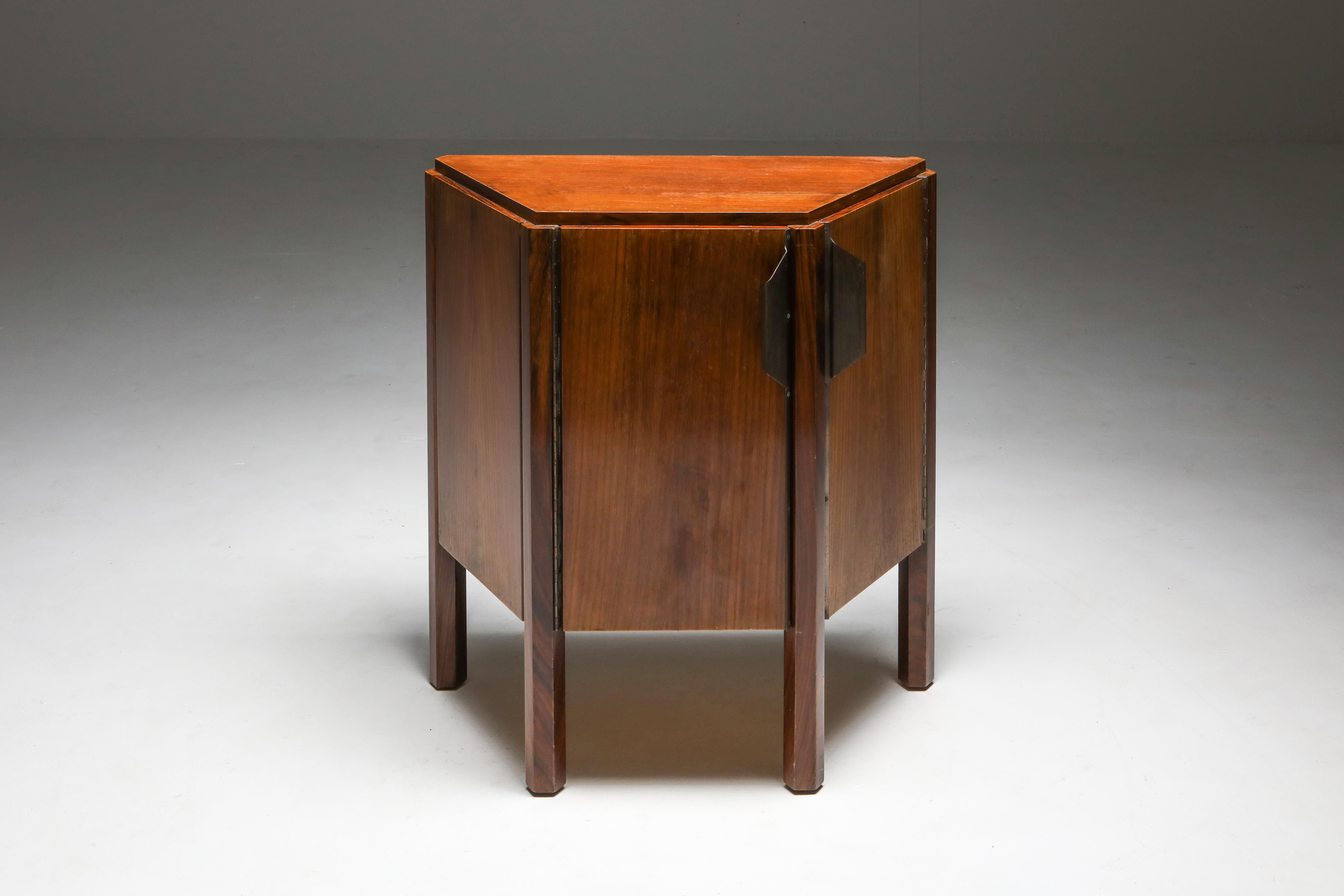 Mid-Century Modern two-door cabinet, Carlo Scarpa, 1950s, Italy.

Trapezoid shaped storage piece in walnut on solid hexagonal legs.
The cabinet lights up inside.
Could also serve as a side or bedside table.

    


  