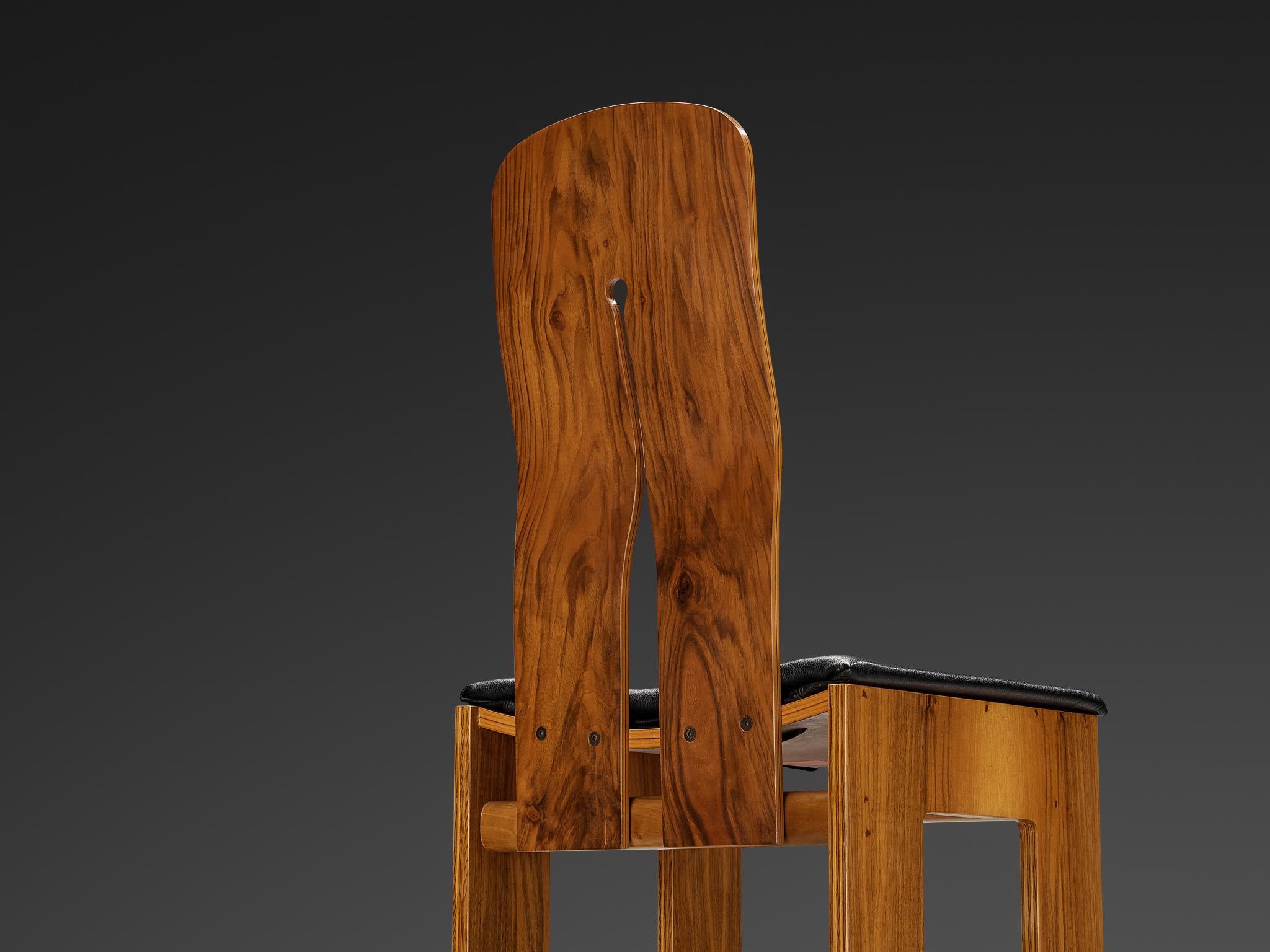 Carlo Scarpa for Bernini, dining chair model '765', walnut, black leather, design 1934, production 1970s

This well-proportioned chair is designed by Carlo Scarpa in 1934, a design that was not produced until 1977. He exclusively created these