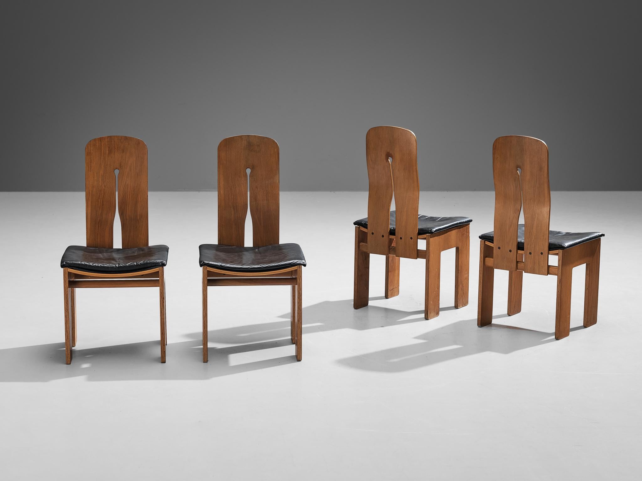 Carlo Scarpa for Bernini, set of four dining chairs, model '765', walnut veneer, leather, designed in 1934, produced in 1977. 

These well-proportioned chairs are designed by Carlo Scarpa in 1934, a design that was not produced until 1977. He