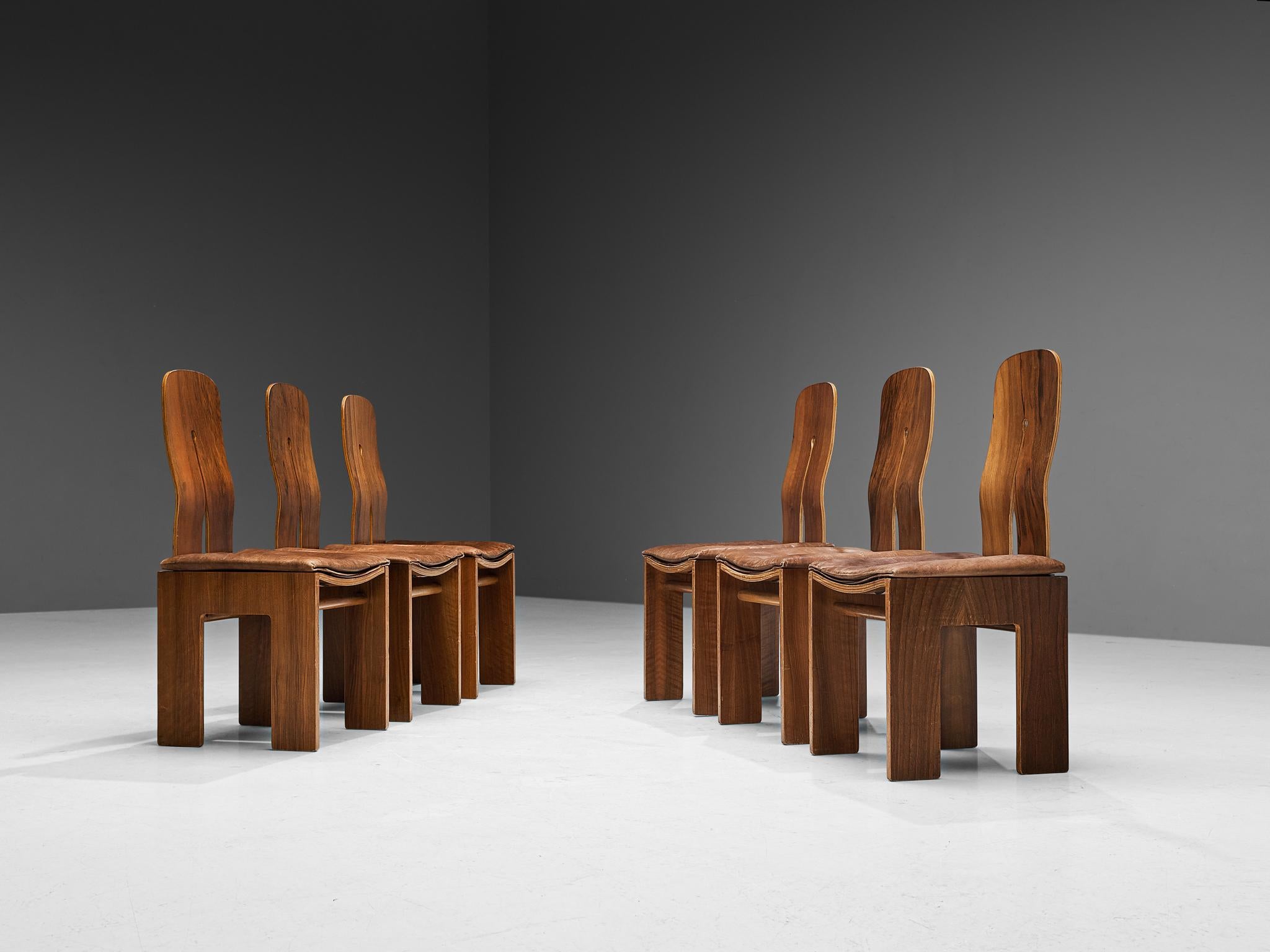 Carlo Scarpa for Bernini, set of six dining chairs model '765', walnut, leather, designed in 1934, produced in 1977. 

These well-proportioned chairs are designed by Carlo Scarpa in 1934, a design that was not produced until 1977. He exclusively