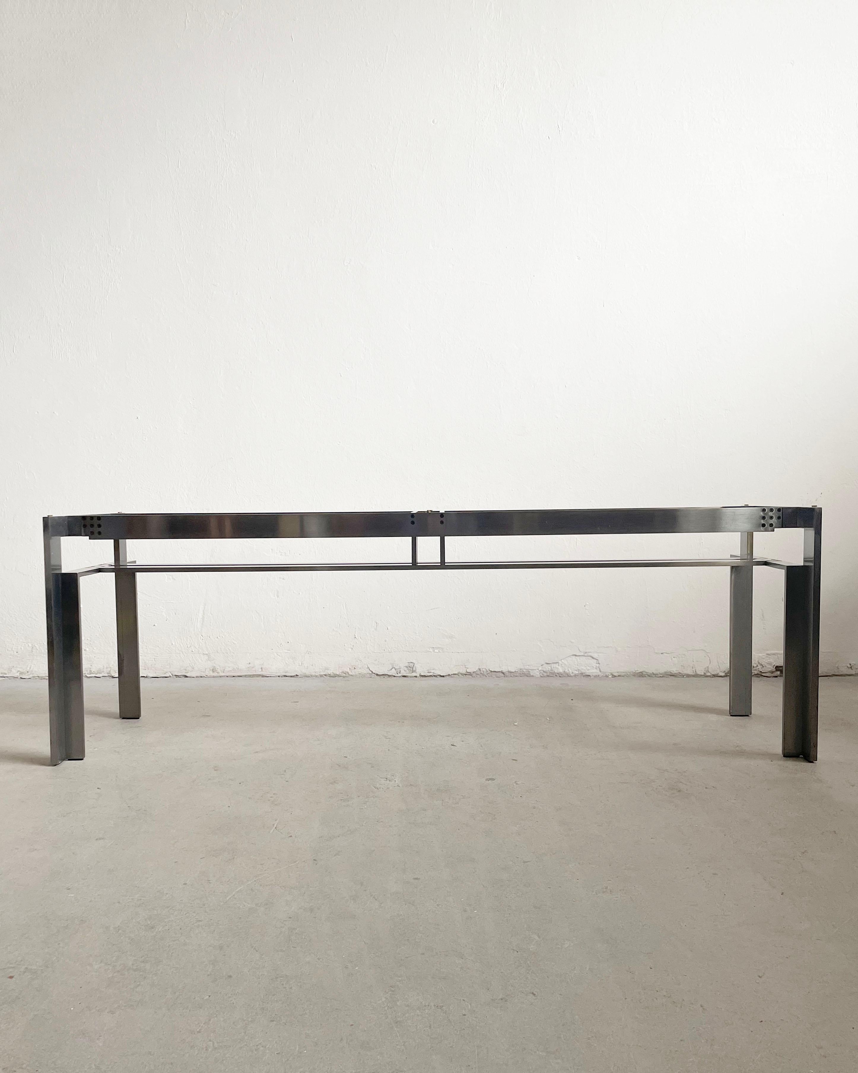 Doge table in glass and steel, designed in 1968 by one of the most influential Italian architects and designers Carlo Scarpa for the great Italian visionary Dino Gavina and his company Simon, represents the very first product of the Ultrarazionale