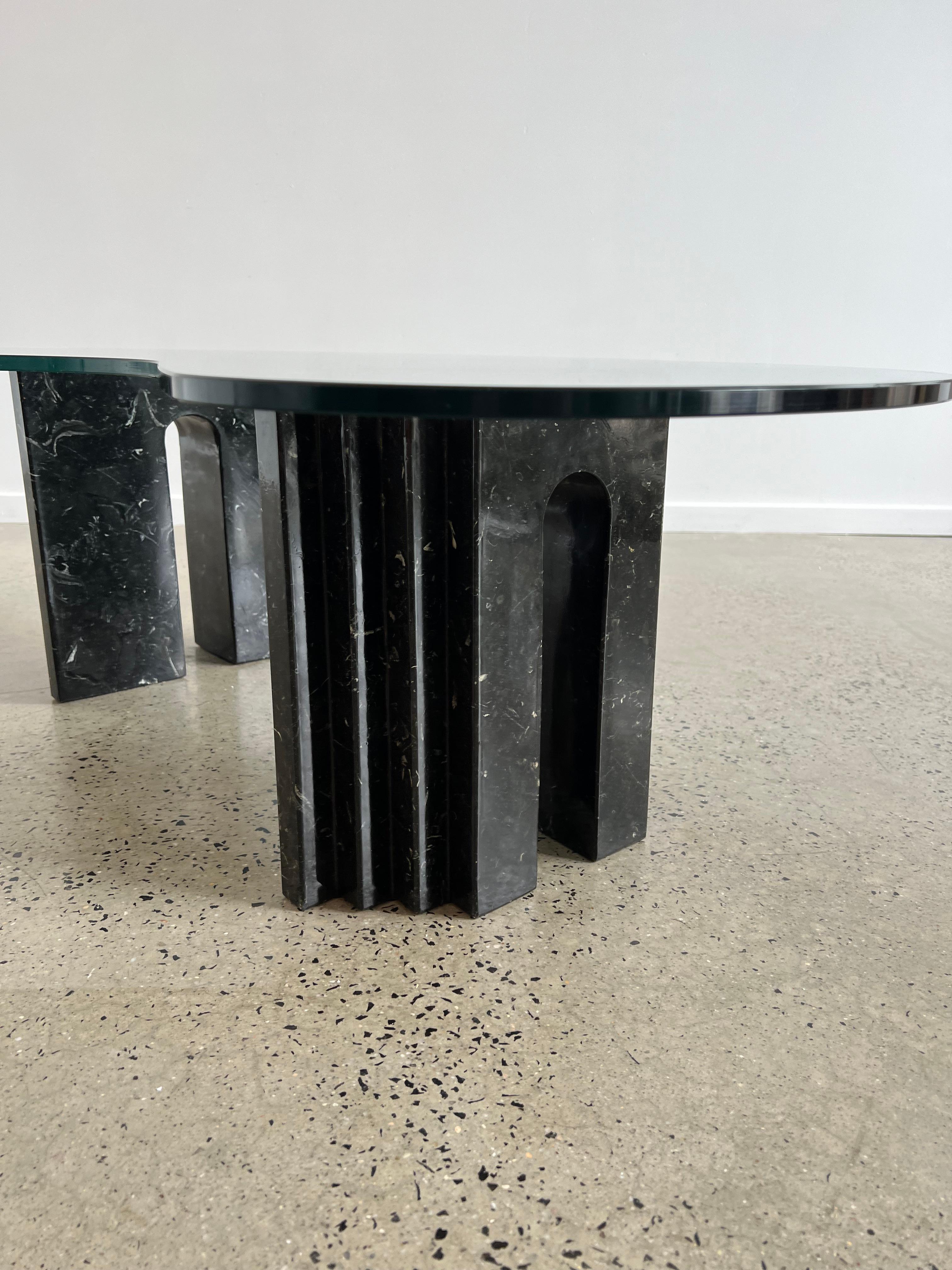 Table in black Carrara marble by Carlo Scarpa, with art shaped top glass, Italy circa 1970 in perfect and original conditions. Two different way to place the base. Dimensions: with top glass 120 x 80 x 40cm. the marble base 42 x 13 x 38cm.
 