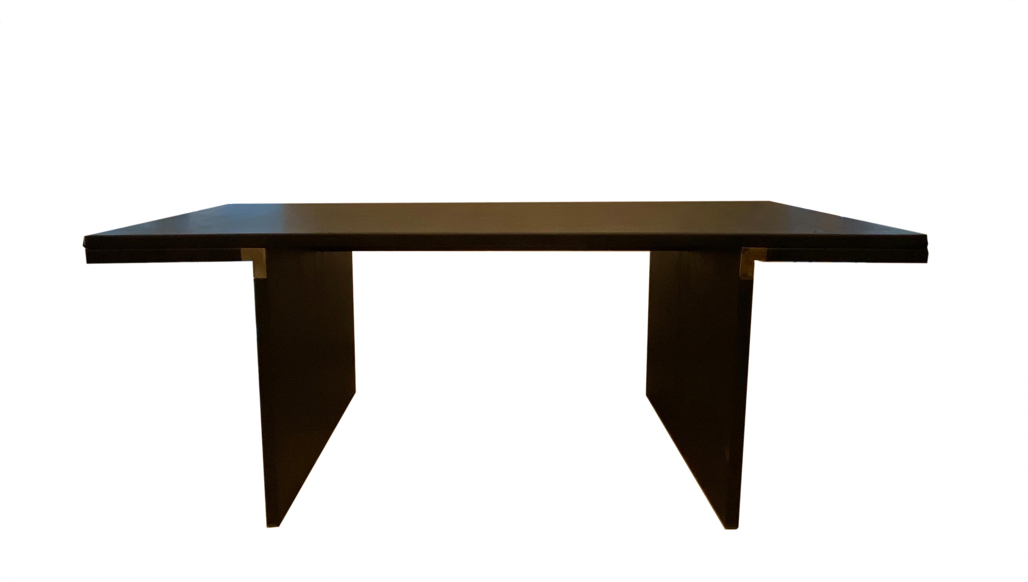 This long black Mod. 'Orseolo' rectangular polyester dining table was designed by Carlo Scarpa in 1972 for Gavina. This is a rare and luxurious first edition. The unusual brass corner construction gives the otherwise completely black table that