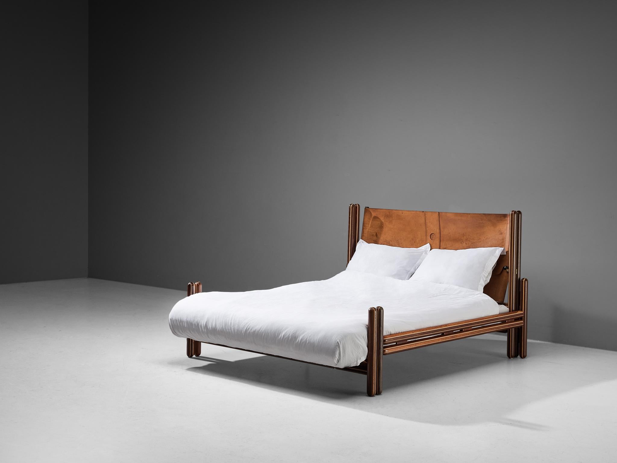 Carlo Scarpa for Simon Gavina, 'Toledo' queen bed, padouk, maple, leather, aluminum, Italy, 1975

Created by the Italian master Carlo Scarpa, this bed clearly demonstrates his studies in architecture, with geometric shapes and constructive elements