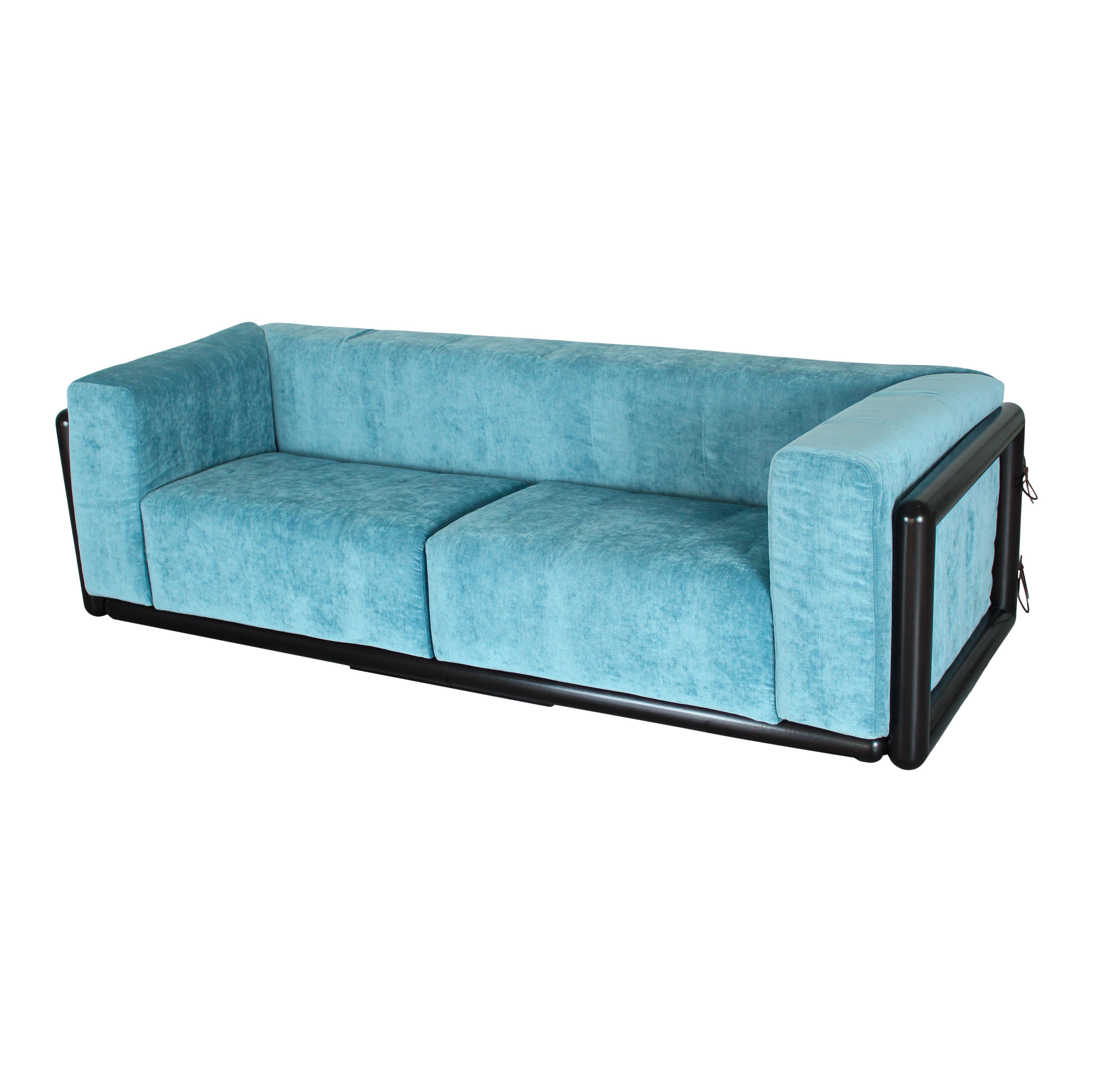 Cornaro two-seater sofa, designed by Carlo Scarpa and manufactured by Studio Simon in 1974.

Made of Iroko wood, foam, and azure velvet by JAB.

Fully restored in Italy.

Born in Venice on June 2nd, 1906, Carlo Scarpa began working very early. Only