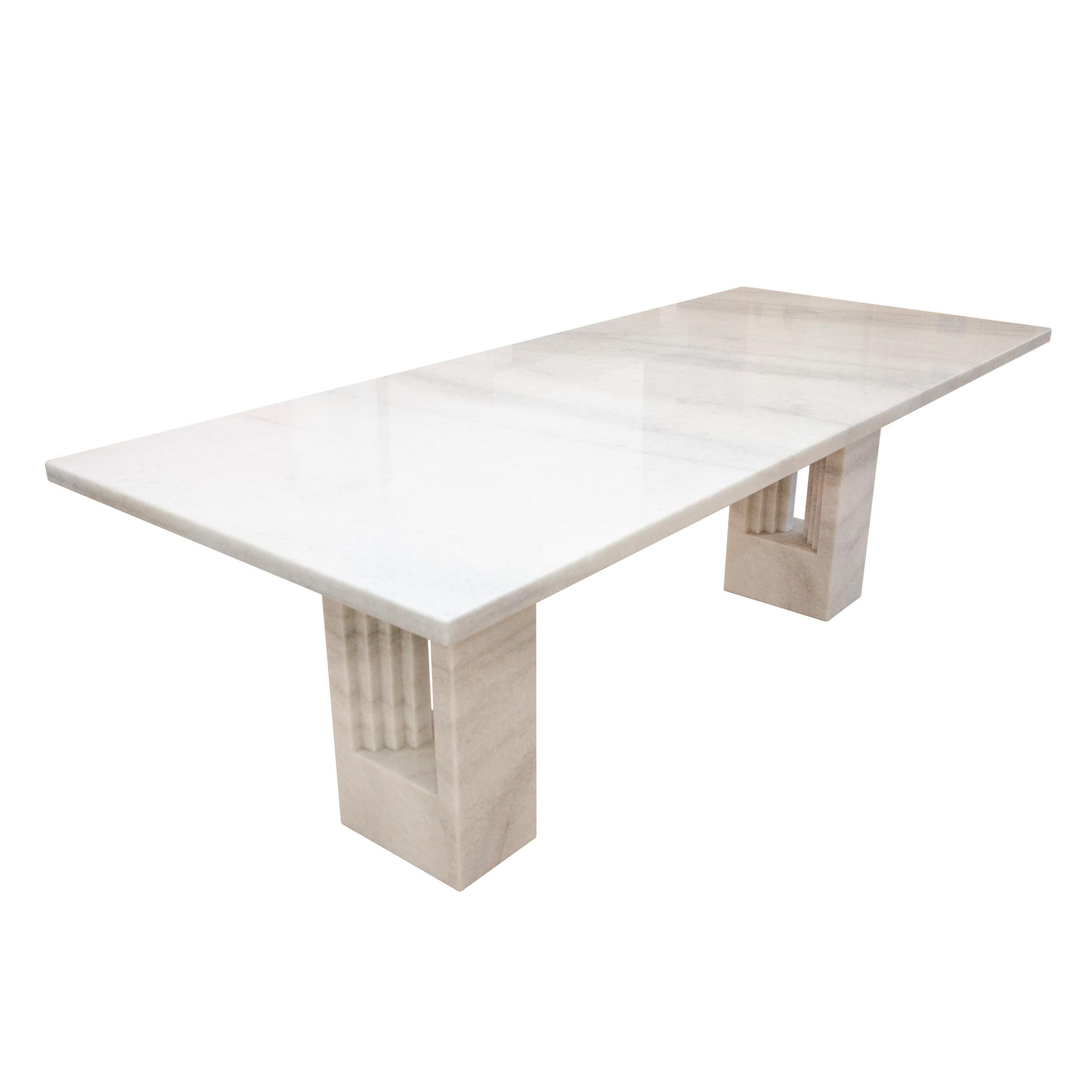 “Delfi” dining table, designed by Carlo Scarpa and Marcel Breuer and produced by the Italian manufacturer Studio Simon in 1969.

Made of white Naxos marble.

Designed in 1969, the marble table was originally made of three pieces (its two feet