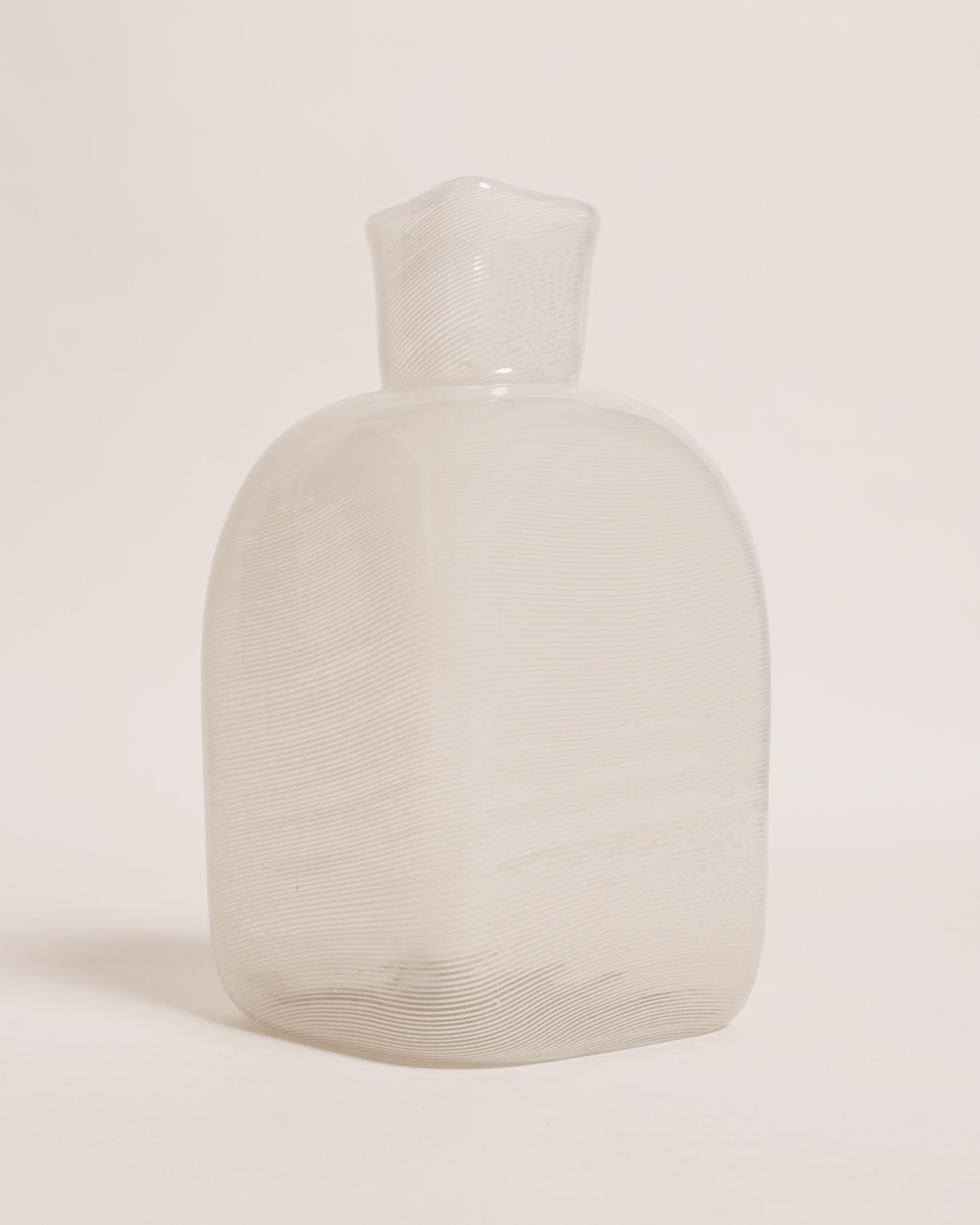 Carlo Scarpa
 'Mezza Filigrana' Vase, c. 1934
Execution: Venini & C. Cased glass, white.
Signed: Venini murano (acid stamp). 
Measure : H : 18 cm (7.08