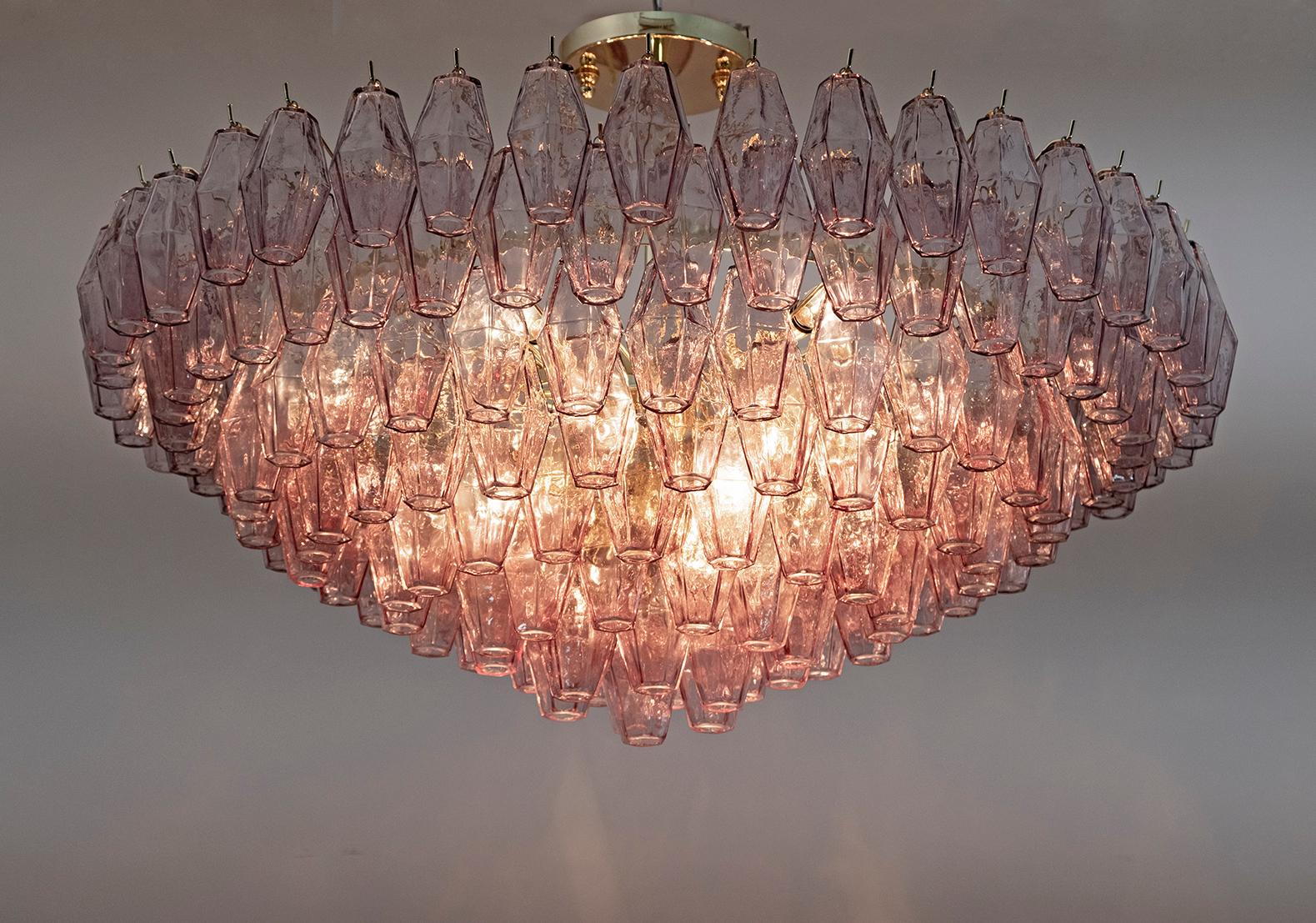 Italian chandelier from the island of Murano. This piece has a brass frame that supports an impressive array of 178 Murano glass, eggplant-colored, polyhedral shaped pieces. Illuminated by 13 E14 bulbs (for the USA we supply E12 adapters). The