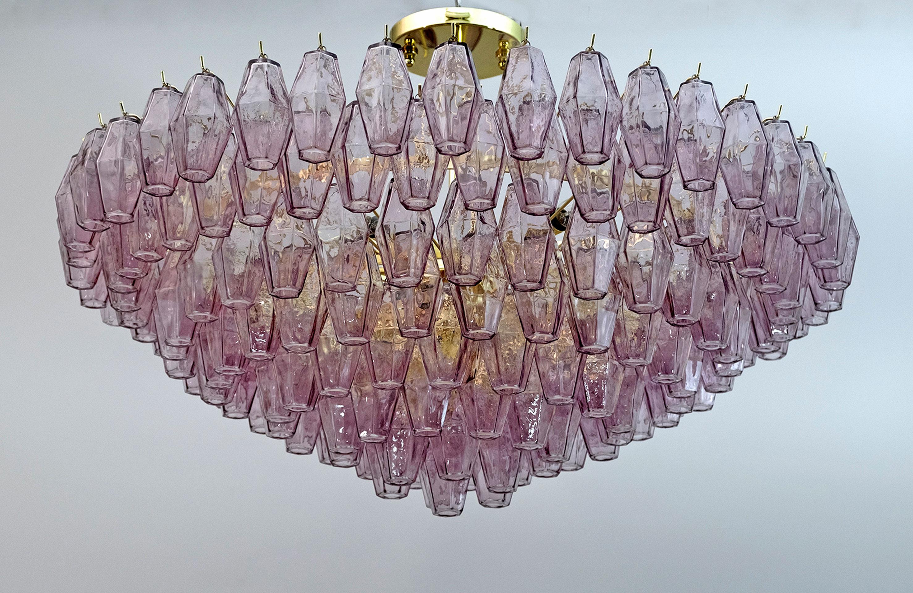 Italian chandelier from the island of Murano. This piece has a brass frame that supports an impressive array of 178 Murano glass, eggplant-colored, polyhedral shaped pieces. Illuminated by 13 E14 bulbs (for the USA we supply E12 adapters). The