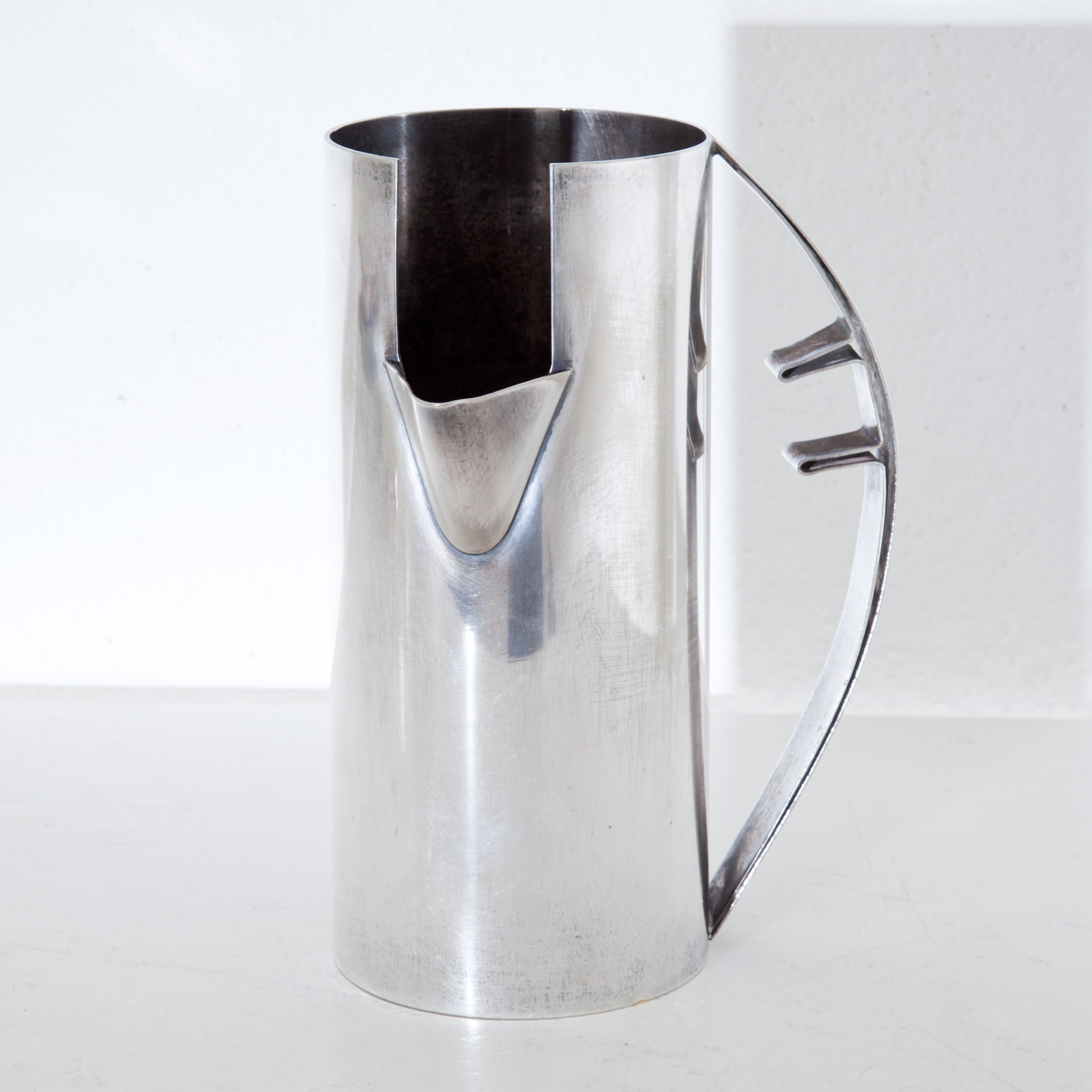 Silver plated Carlo Scarpa pitcher in Minimalist design. Stamped on the base Carlo Scarpa per Cleto Munari and 1000/1000. One small ship in the silver plate at the bottom.