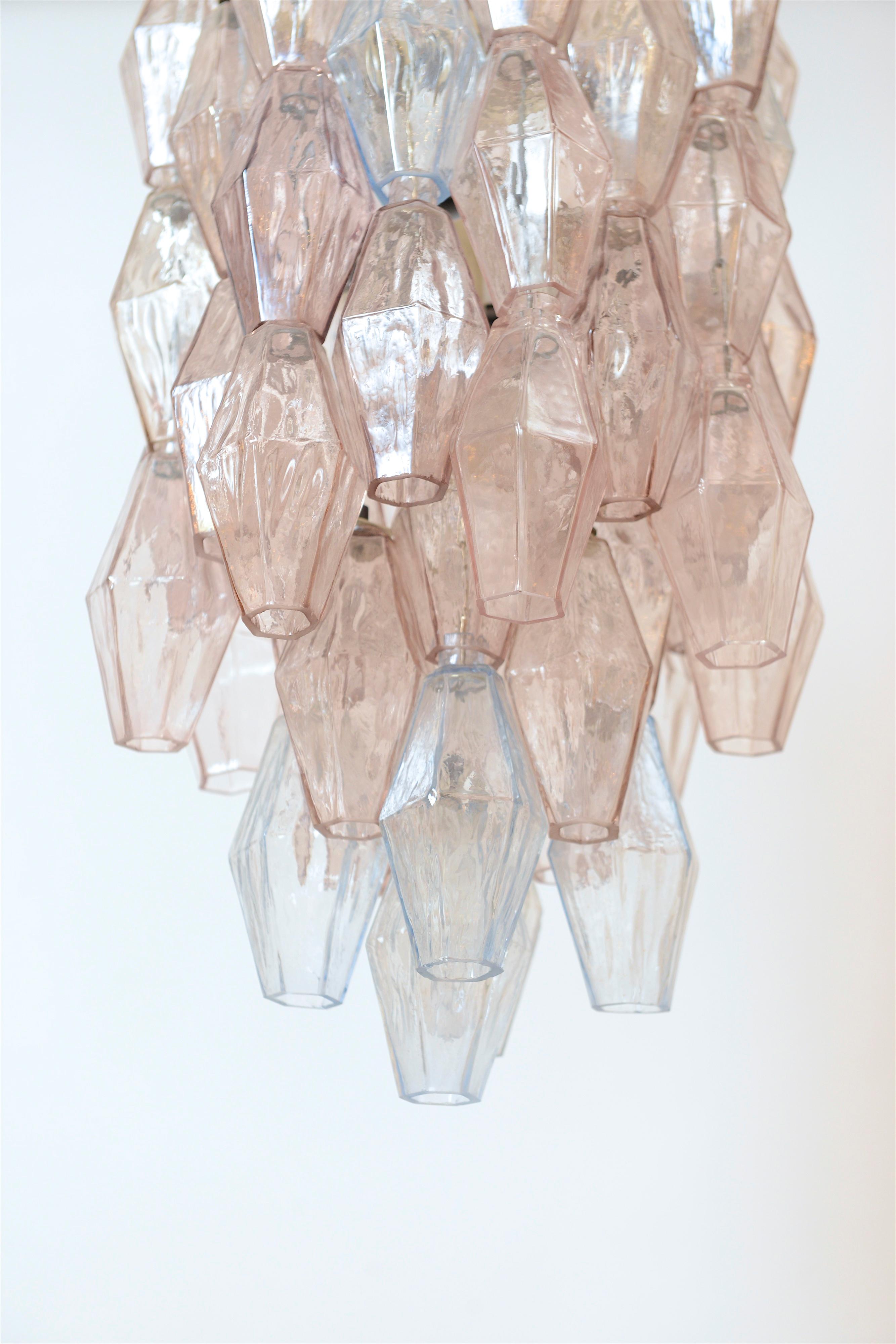 A rare ‘polyhedral’ crystal chandelier designed by architect and designer Carlo Scarpa in the late 1950s. Produced by the prestigious Muranese Company, Venini, the sixty-five hand blown poliedri consist of clear, pink and blue colored crystals, each