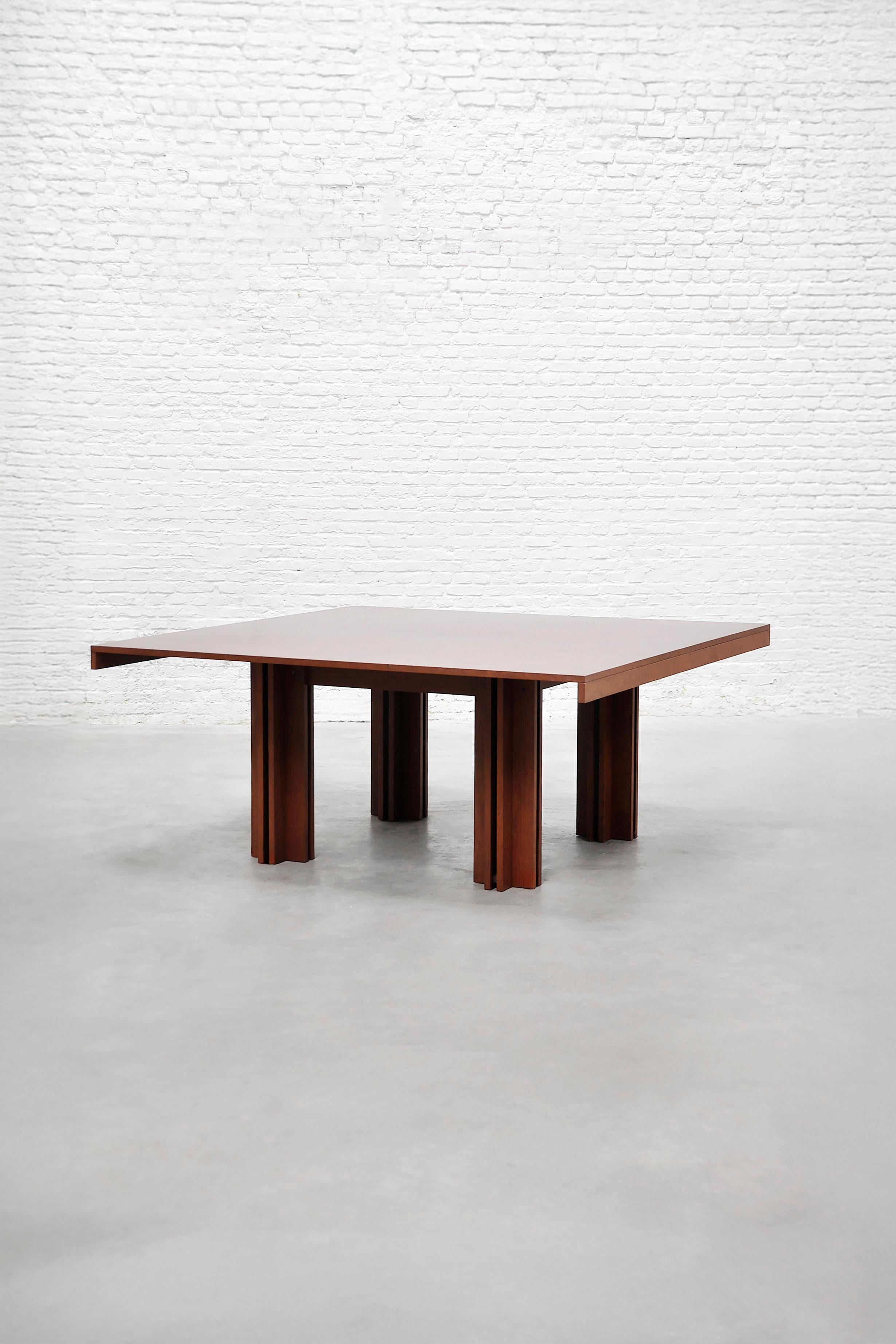 Designed by Carlo Scarpa and produced by Simon Gavina in 1974, this large Quatour table is a measured and thoughtful piece, translating architectural ideas into furniture. Originally sketched by Scarpa in 1947, the design was brought into production