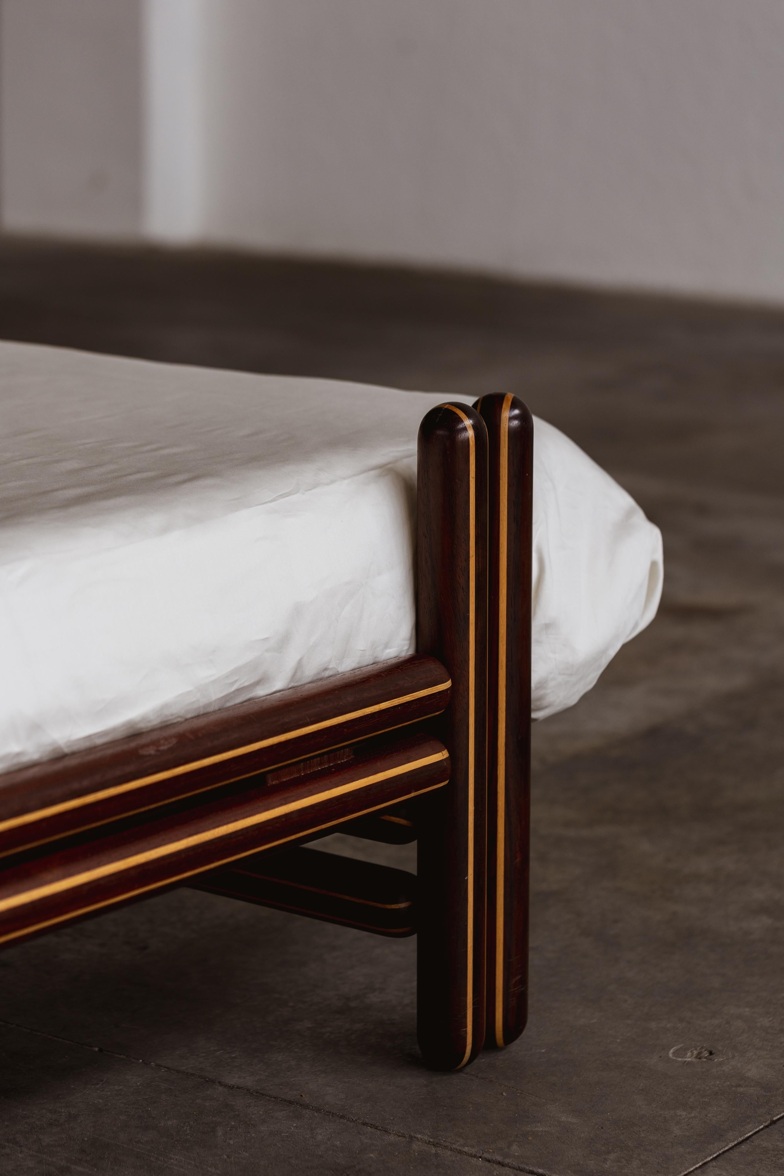 Carlo Scarpa “Toledo” Bed for Simon Gavina, maple, brass, cognac leather, Italy, 1975.

This Carlo Scarpa bed expresses his great passion for architecture and symmetry. The great Italian master originally conceived the bed from a formal idea