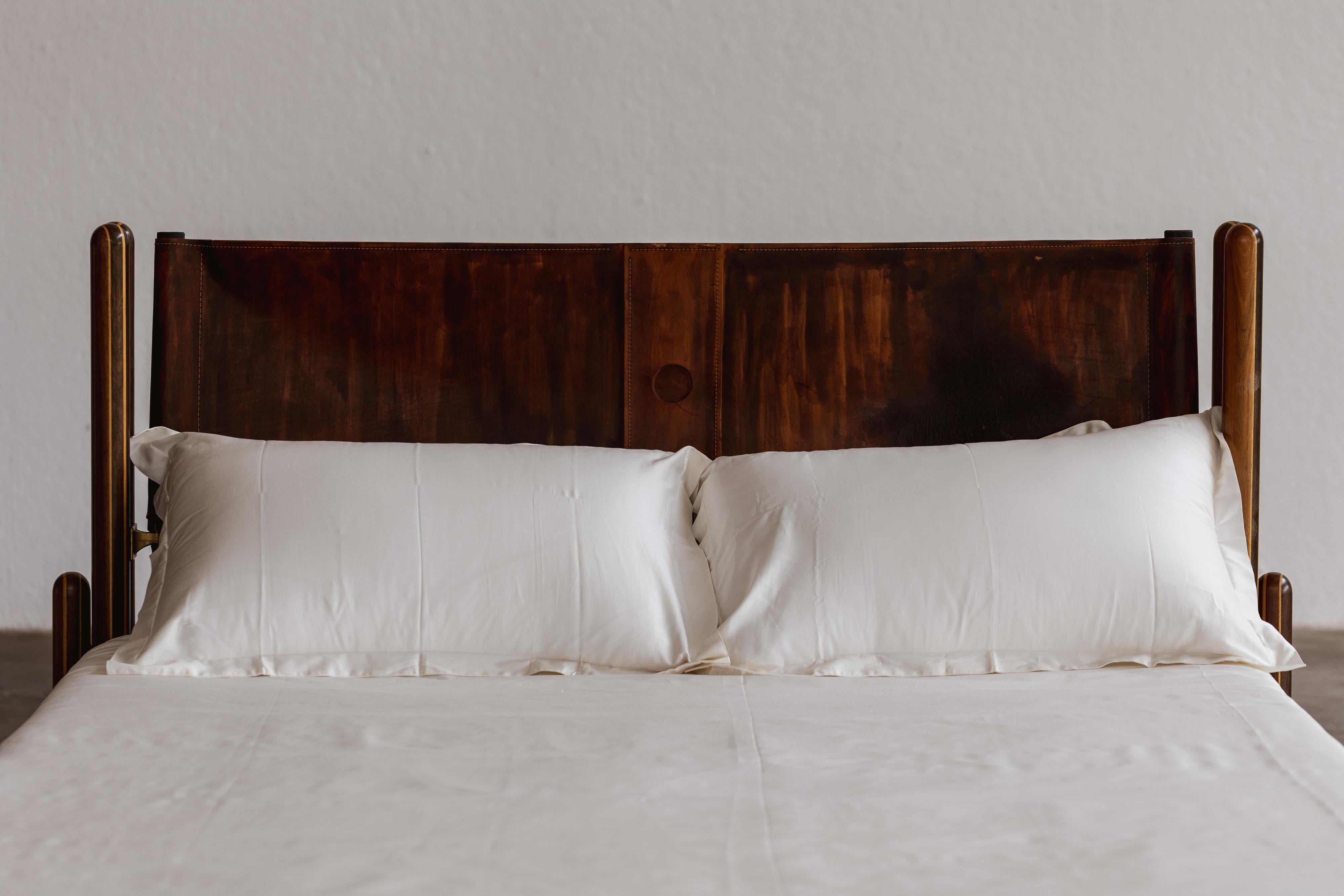 Carlo Scarpa “Toledo” Bed for Simon Gavina, maple, brass, leather, Italy, 1975.

This Carlo Scarpa bed expresses his great passion for architecture and symmetry. The great Italian master originally conceived the bed from a formal idea described in a