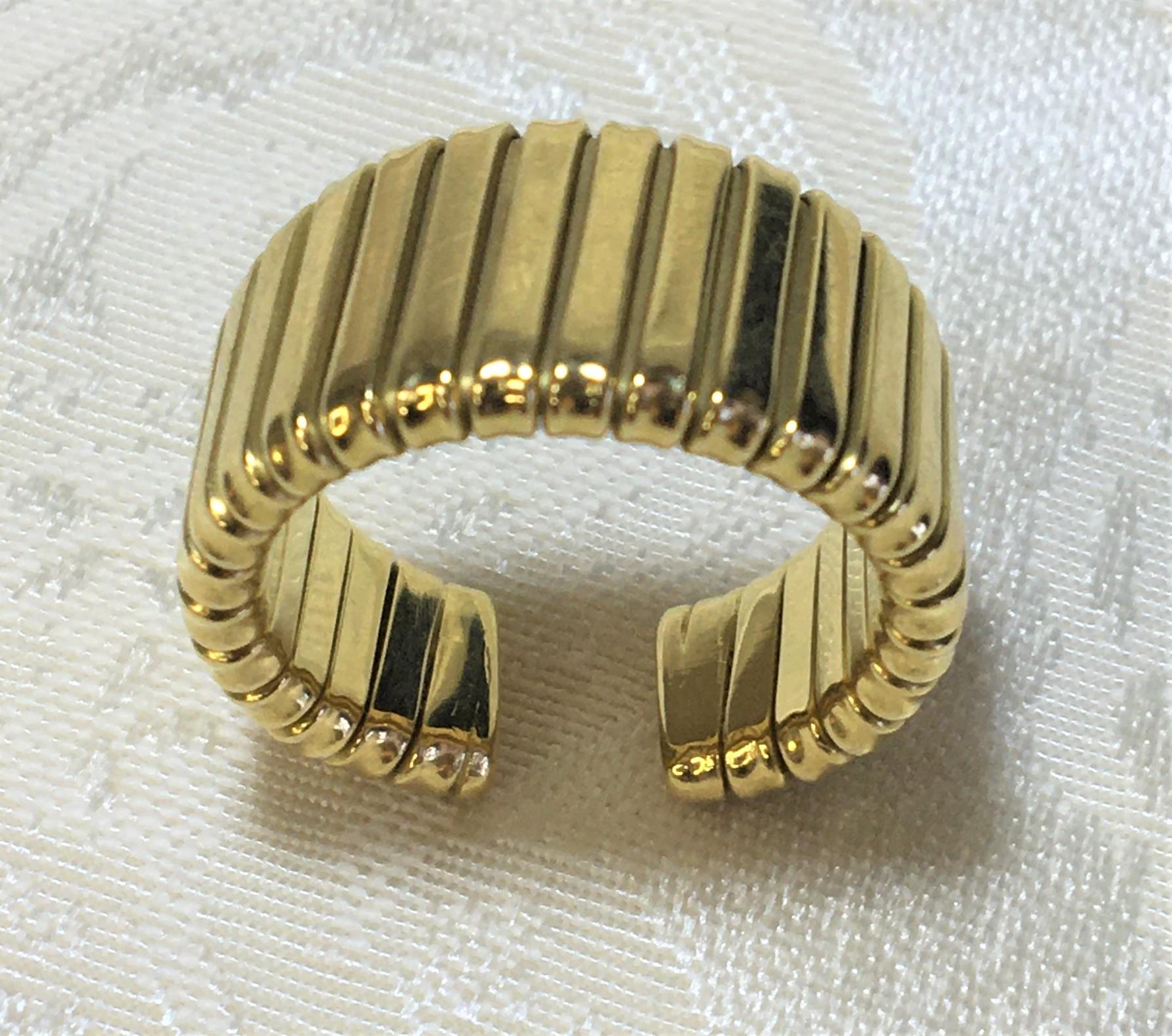 From designer Carlo Weingrill, this wearable set is contemporary without being pretentious.  A beautiful ribbed design that is comfortable to wear.  This is being sold as a set with Earrings and Ring included.
Earrings:
18 karat yellow gold ribbed