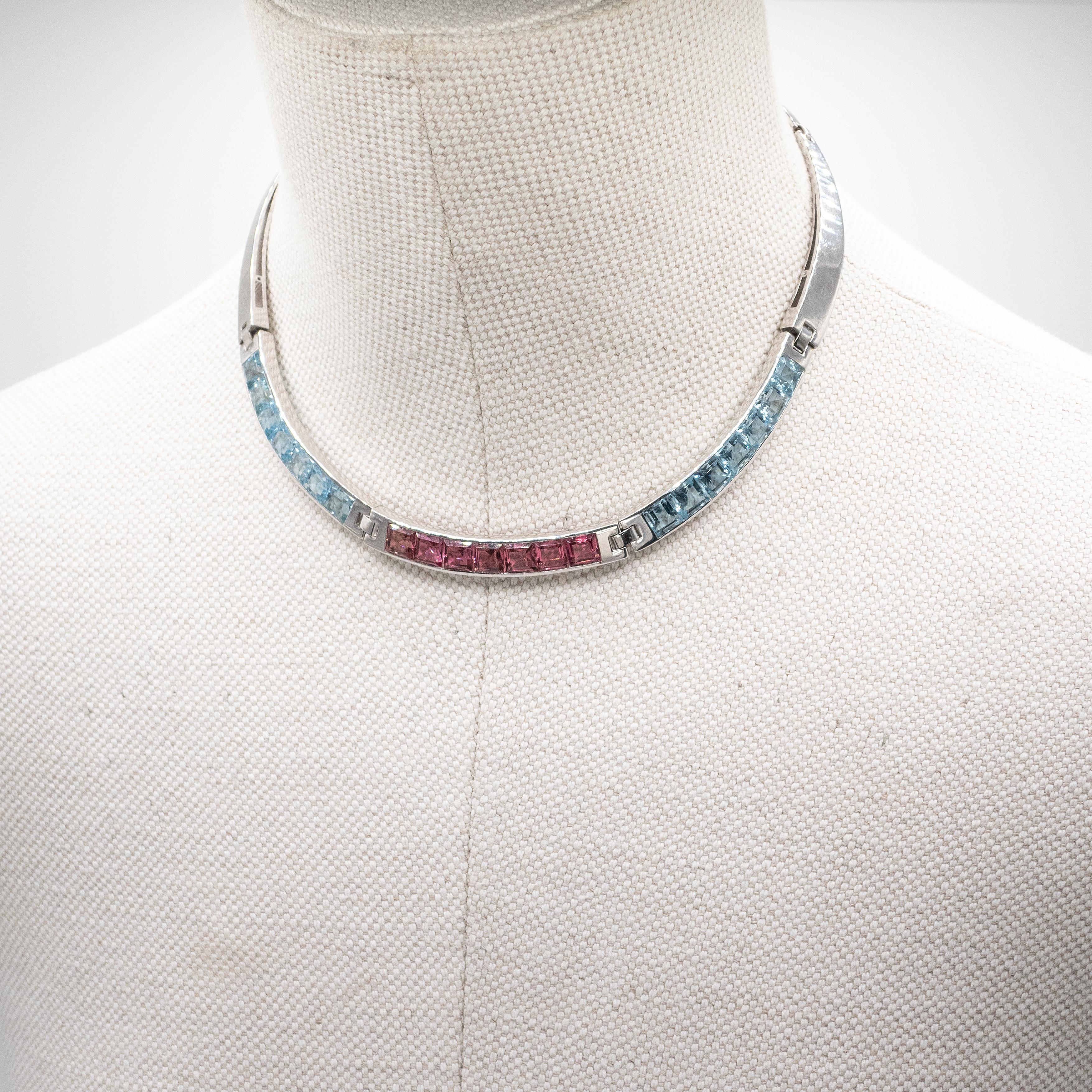 Stunning Carlo Weingrill 18K white gold channel set aquamarine and pink tourmaline choker necklace set with 14 square emerald cut aquamarine and 7 square emerald cut pink tourmaline in high clarity

Carlo Weingrill is credited with being the