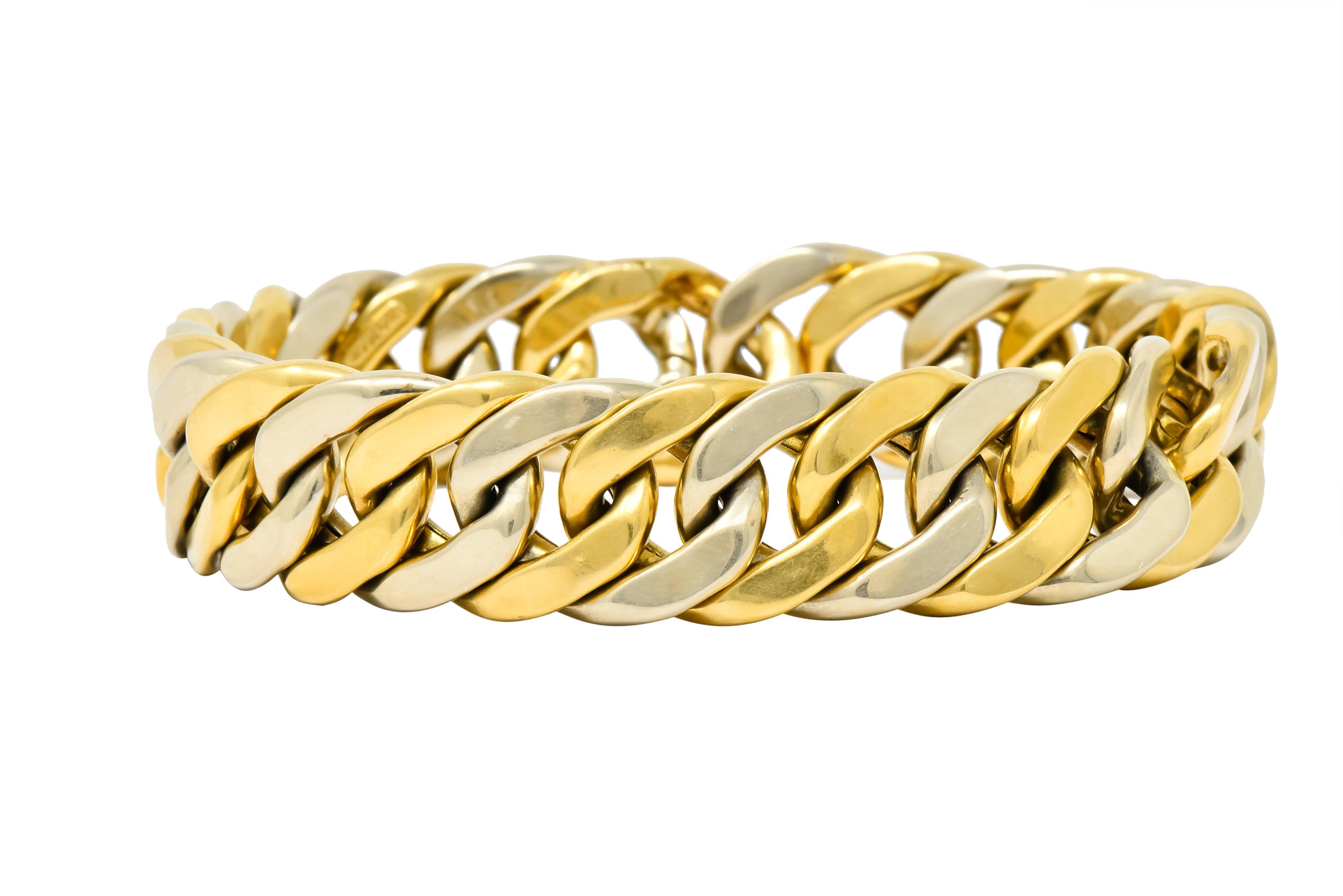 Bracelet comprised of hollow, curbed links alternating white and yellow gold 

With a high polished finish

Completed by concealed hinged clasp 

Signed Weingrill with assay marks for Verona and Missiaglia Italy and maker's mark for Carlo Weingrill