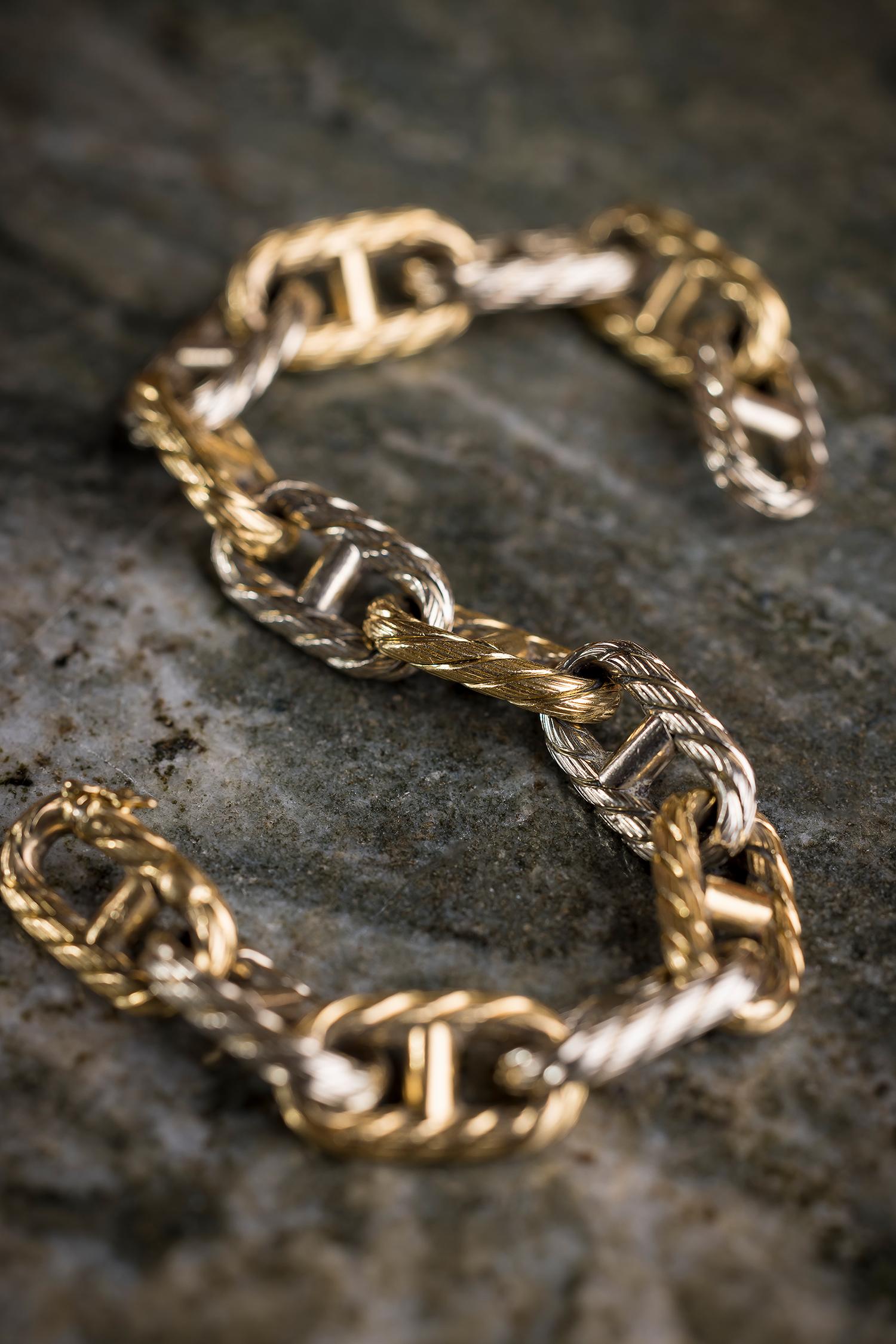 A solid and powerful version of a classic design. Love the texture and how tactile this versatile bracelet is. Keep yourself anchored in this two tone gold bracelet

This bracelet was made by Carlo Weingrill in the 1950s. This has been confirmed in