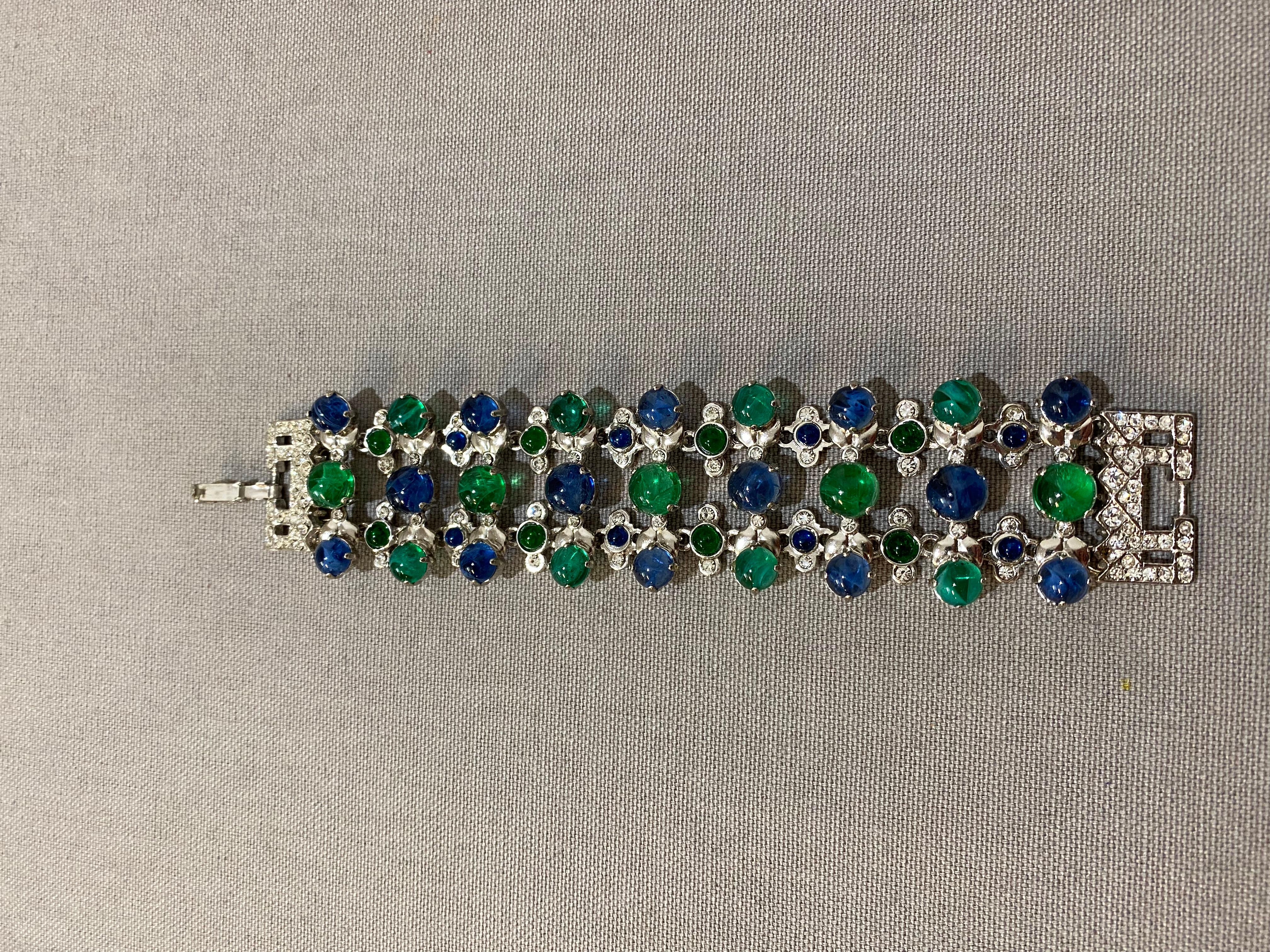 Fantastic piece by Carlo Zini
One of the world greatest bijoux designers
Non allergenic rhodium
Amazing hand application of swarovski crystals 
Emerlad and sapphire like cabochon 
Wrist cm 17 (6.69 inches)
100% Artisanal work
Made in