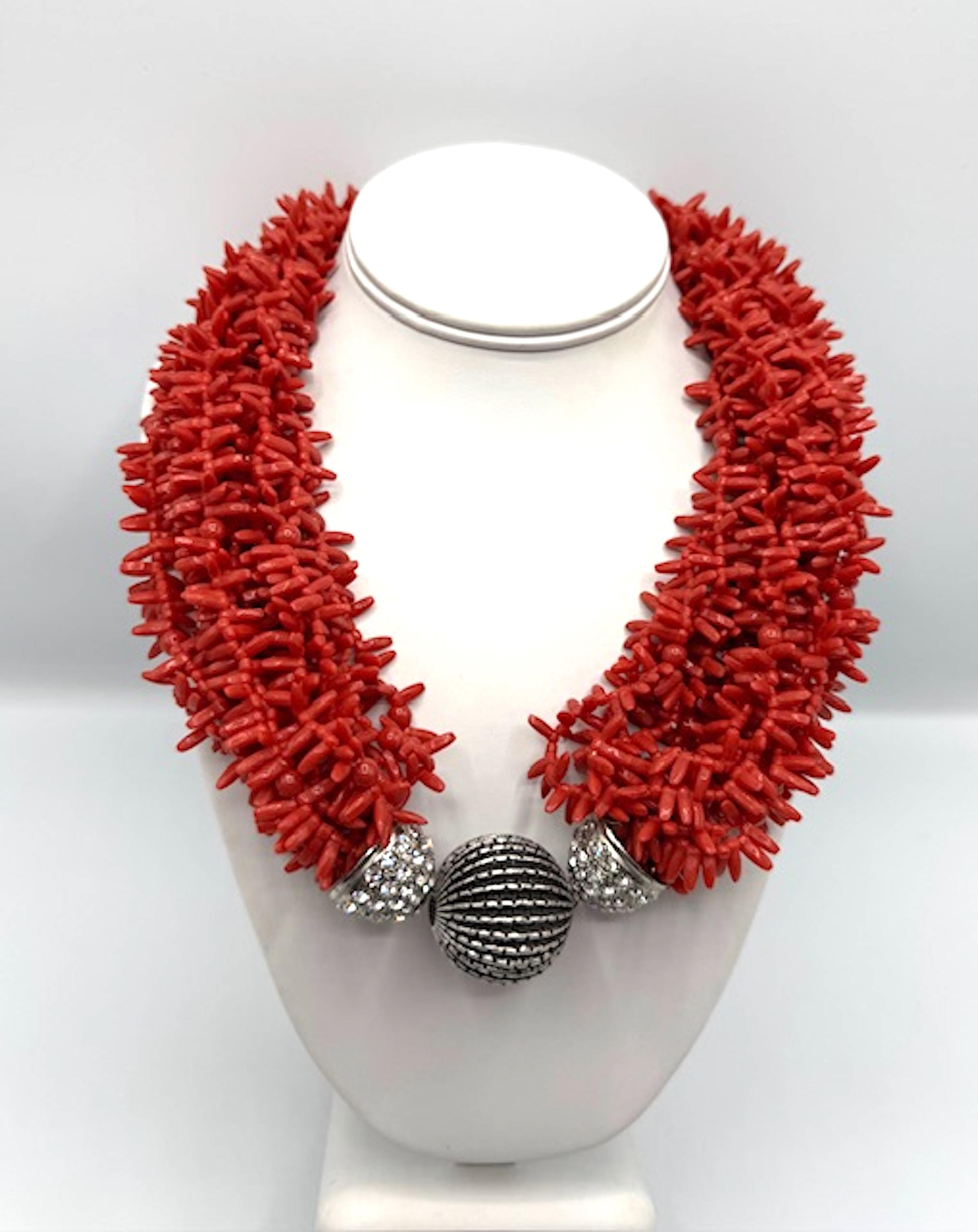 Carlo Zini is an Italian luxury jewerly brand founded in Milan in 1963. It is known for its bold designs, traditional Italian craftsmanship and contemporary style. Presented is a faux Sicilian coral branch multi strand necklace in resin. The center