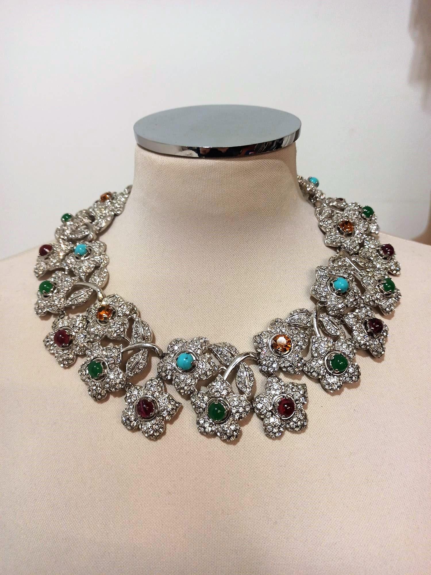 Fantastic piece by Carlo Zini
One of the world greatest bijoux designers
Non allergenic rhodium
Floral theme
Ruby, emerald and amber like crystals
Amazing hand application of swarovski crystals
100% Artisanal work
Made in Milano
Worldwide express